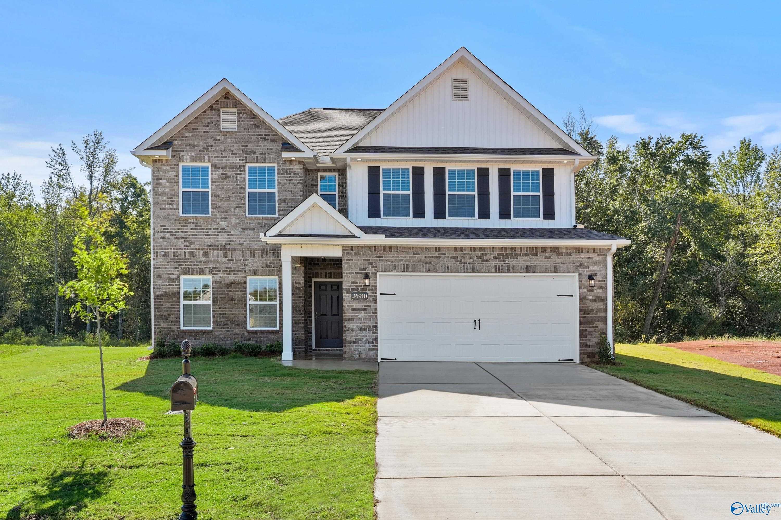 Two-story brick home with 2-car garage and driveway in Ricketts Farm, Athens, Alabama - Davidson Homes The Shelby A
