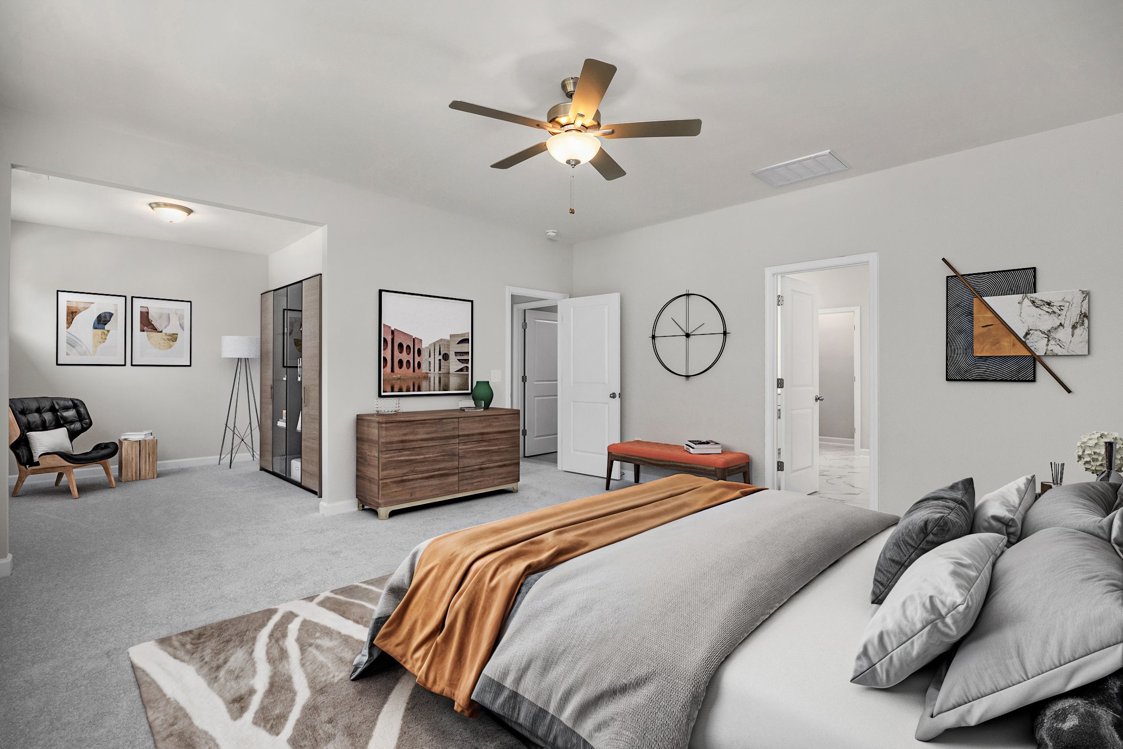 Spacious primary bedroom in Ashland Apex NC with king bed gray walls ceiling fan and modern artwork by Davidson Homes