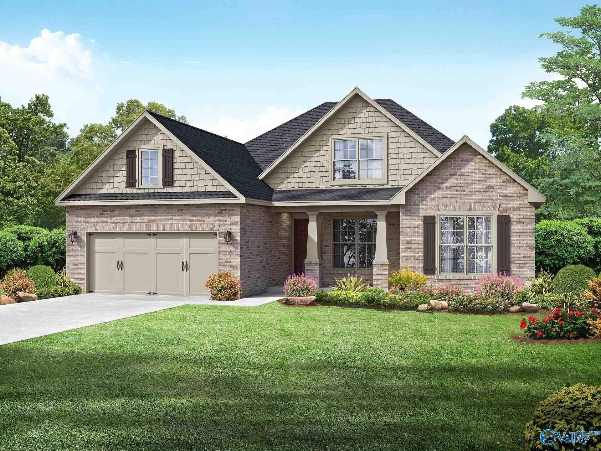 Modern 1.5-story Rockford B home with brick accents, 2-car garage, and landscaped yard in Barnett's Crossing, Madison, Alabama