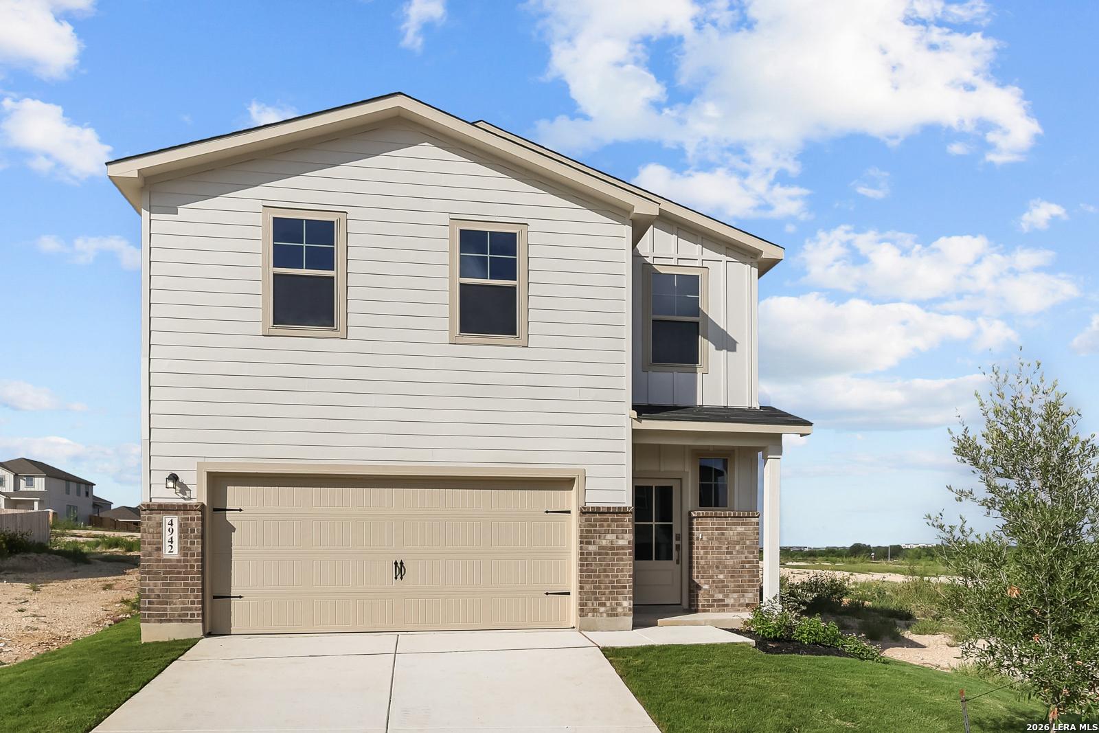 Two-story, 5-bedroom Brazos B floor plan by Davidson Homes with a 2-car garage in Agave, San Antonio, Texas.