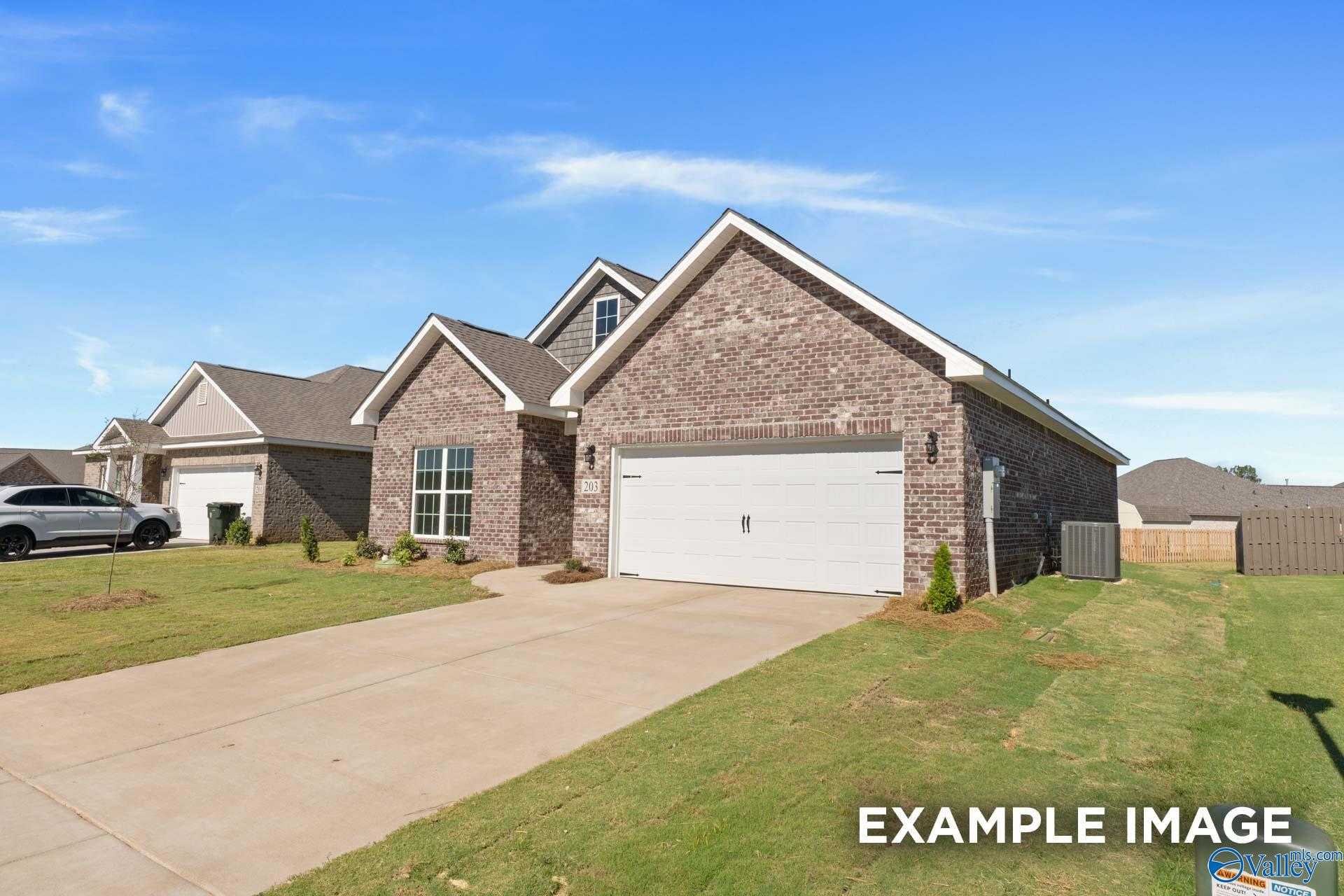 Brick single-story home with 2-car garage, driveway, and landscaped yard in Walker's Hill, Meridianville, Alabama - Davidson Homes The Franklin C