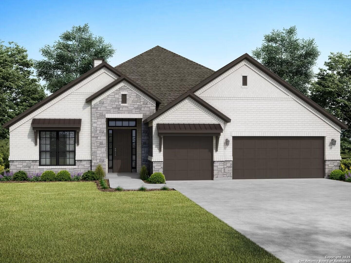 Modern single-story 4-bedroom home with stone accents, 3-car garage, and landscaped yard in Ladera, San Antonio, Texas by Davidson Homes The Garner B