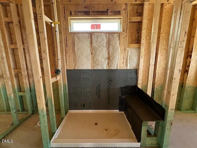 Walk-in shower framing with built-in bench in The Carter A floor plan at Gregory Village, Lillington, North Carolina.