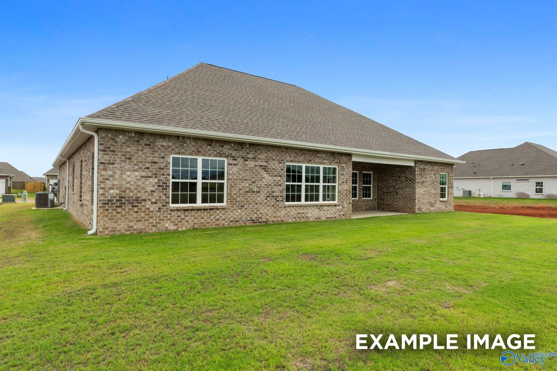 Back exterior view of The Finleigh floor plan by Davidson Homes in Briercreek, Meridianville, Alabama with a grassy yard.
