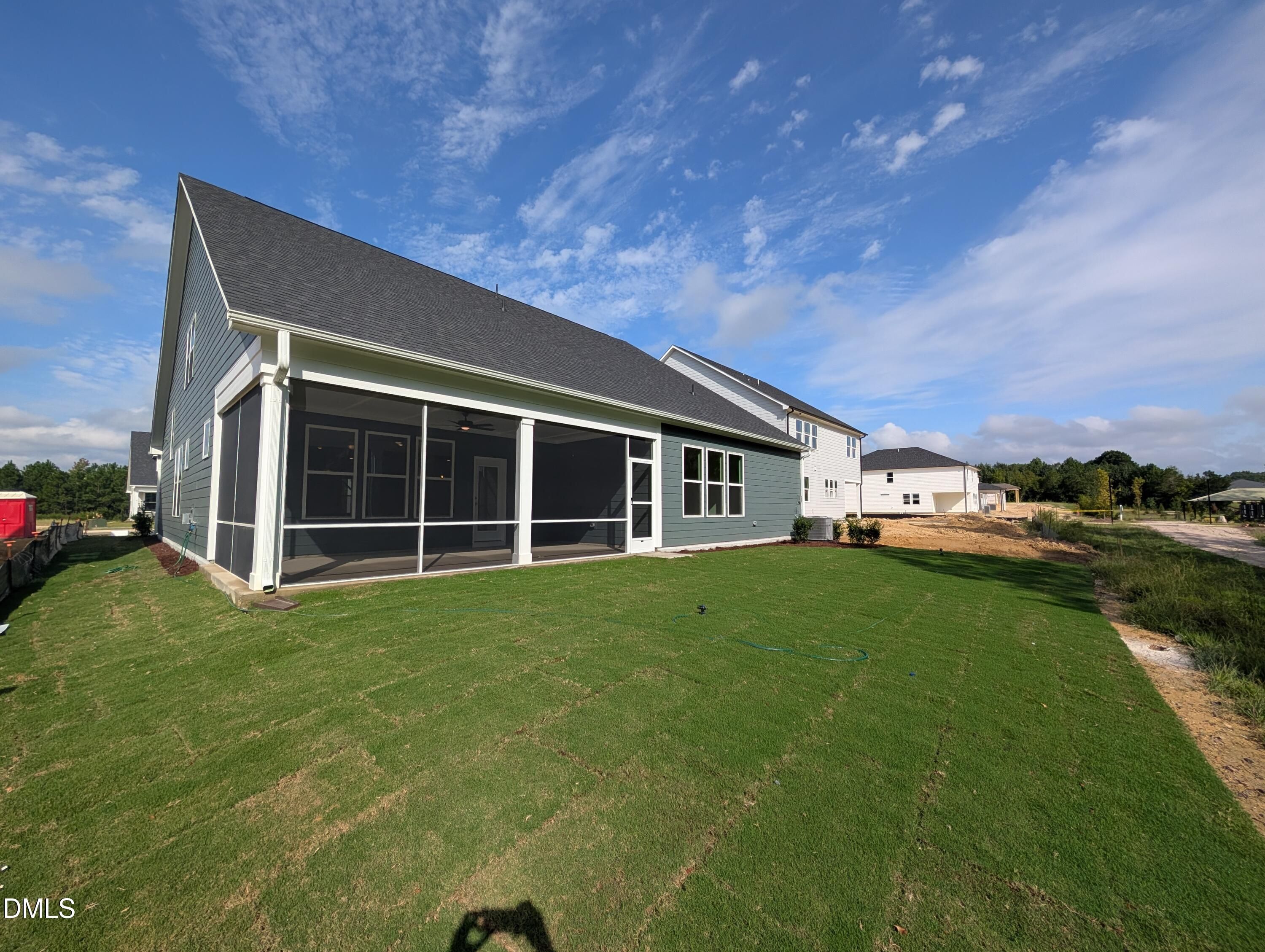 Screened back porch overlooking spacious fenced backyard of Davidson Homes Magnolia A new construction home in Wendell Ridge, Wendell, NC