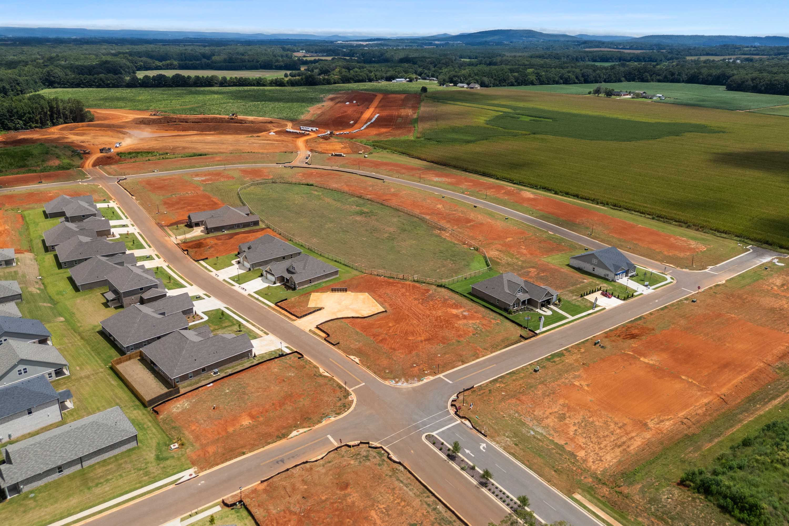 Aerial view of Kendall Farms neighborhood in Toney, Alabama with new homes by Davidson Homes and surrounding farmlands