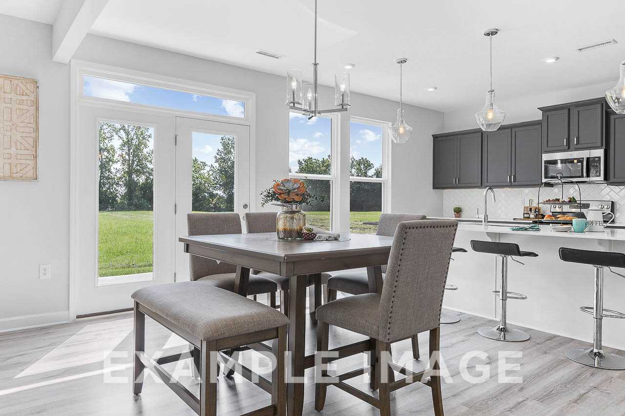 Davidson Homes the Chestnut Plan Dining Area with table and chairs