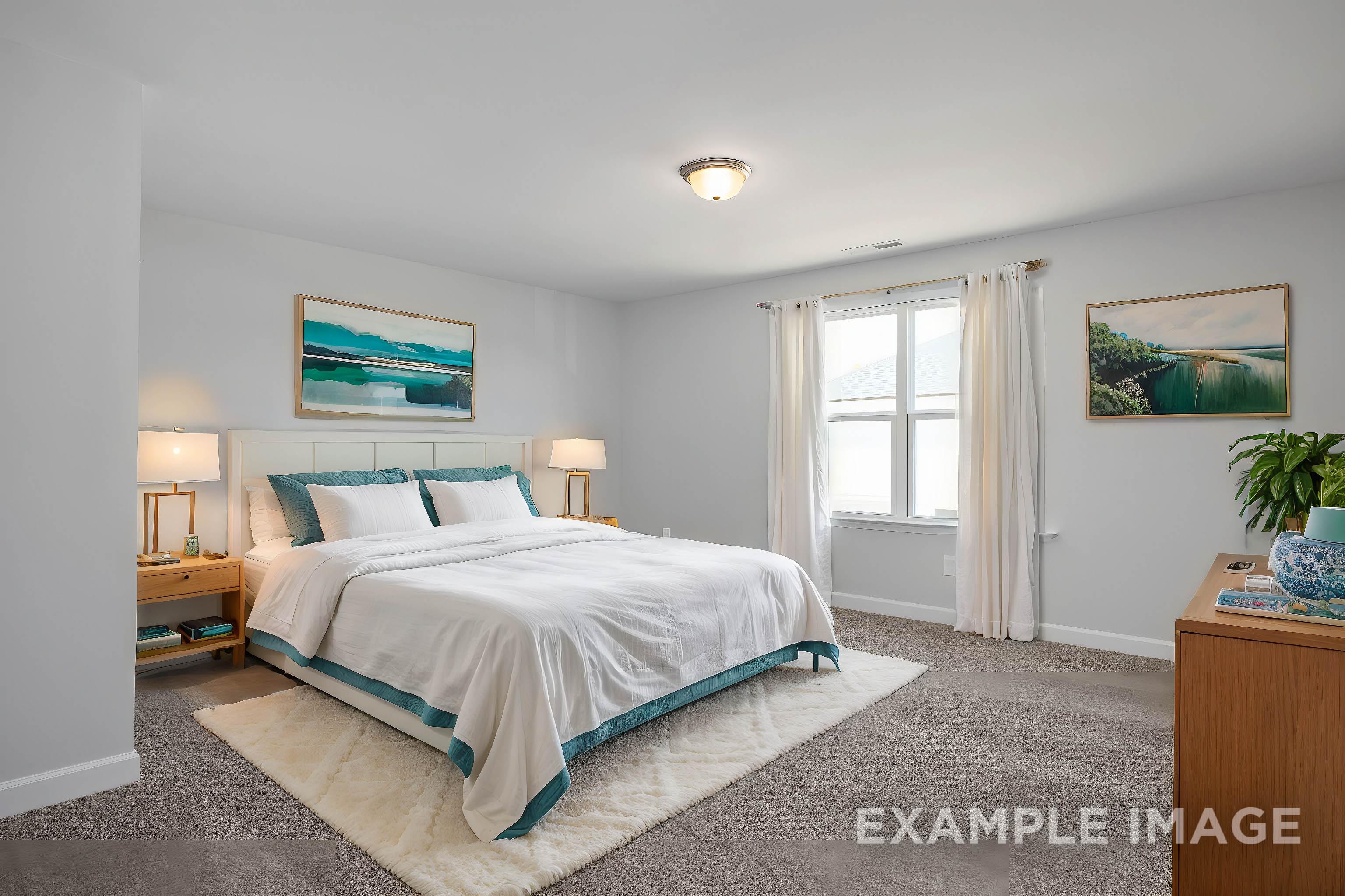 Spacious master bedroom in The Ash by Davidson Homes featuring king bed with teal accents, large window, and modern decor