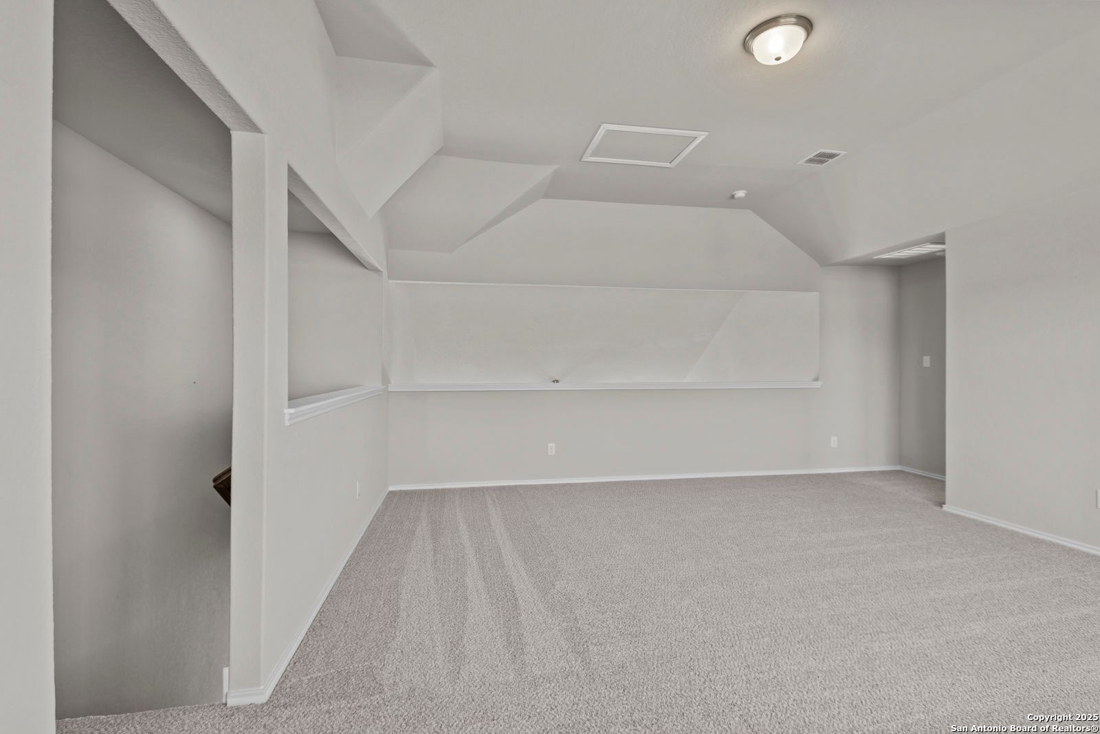 Vaulted ceiling flex room with built-in shelves, carpet floor, and recessed lighting in Davidson Homes The Collin B, Seguin, Texas