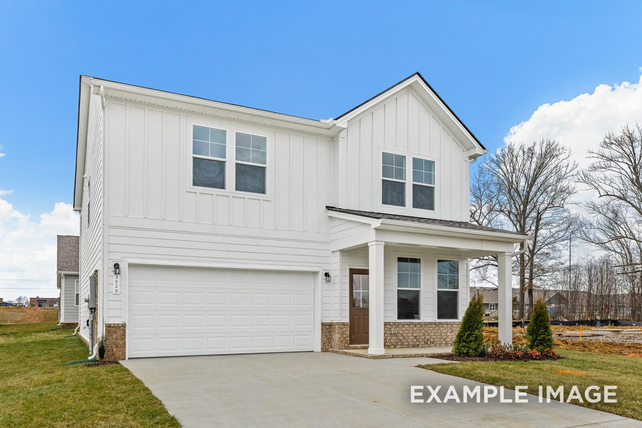 Two-story Logan C home elevation with white board and batten siding, covered porch, and two-car garage in White House, TN