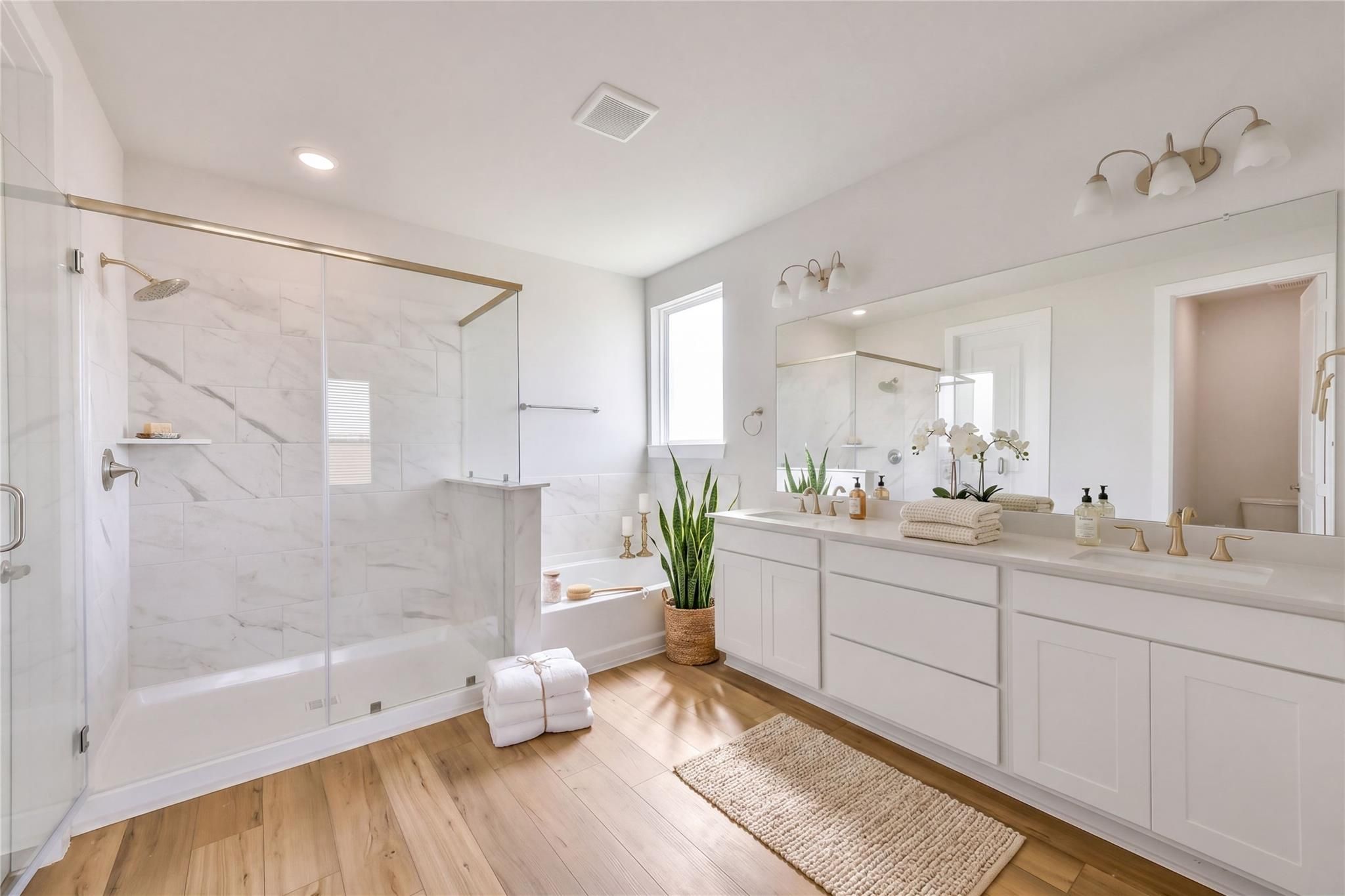 Luxurious master bathroom with marble glass shower, soaking tub, double vanity in Davidson Homes The Victoria A, Lago Mar, Texas City