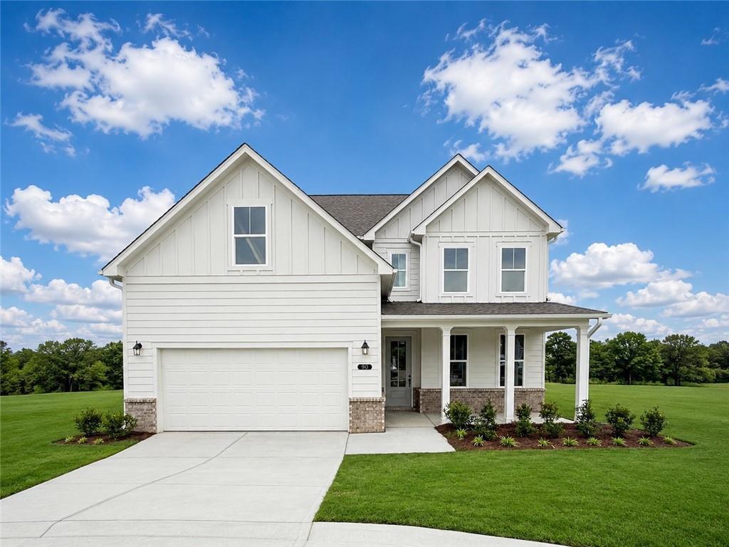 Two-story, white farmhouse style Hickory B floor plan by Davidson Homes in Wehunt Meadows, Hoschton, Georgia.