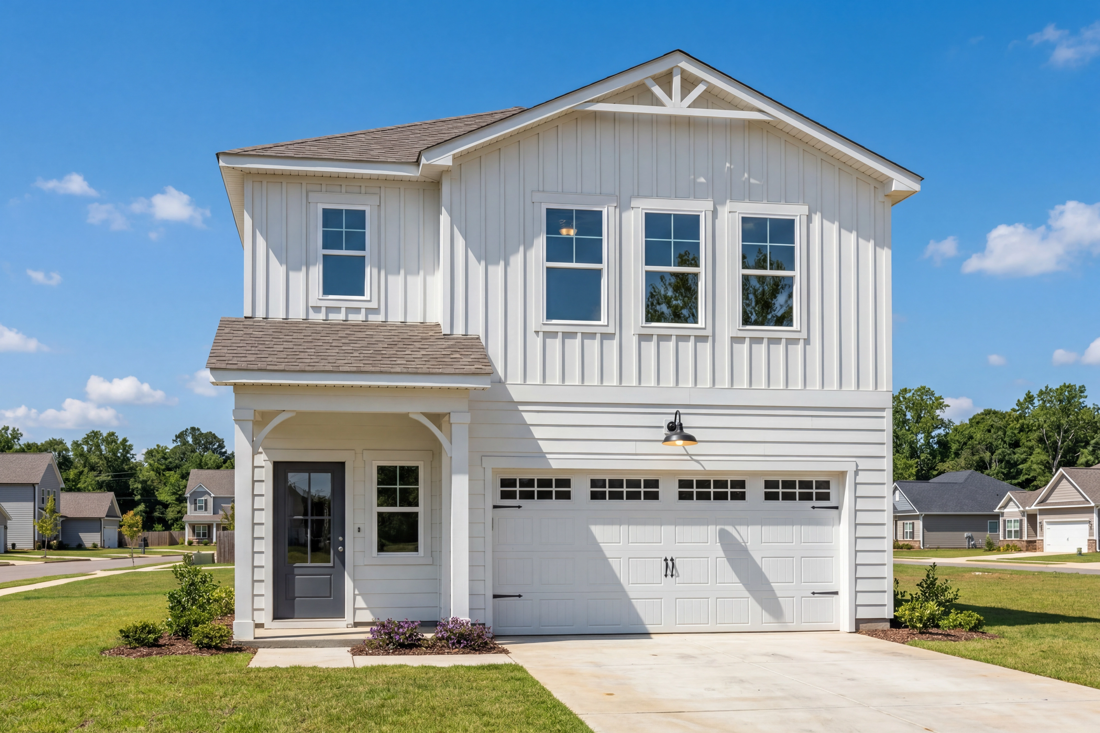 Craftsman-style exterior of The Hartwell B, a 2-story single-family home with white shingle siding and a 2-car garage.