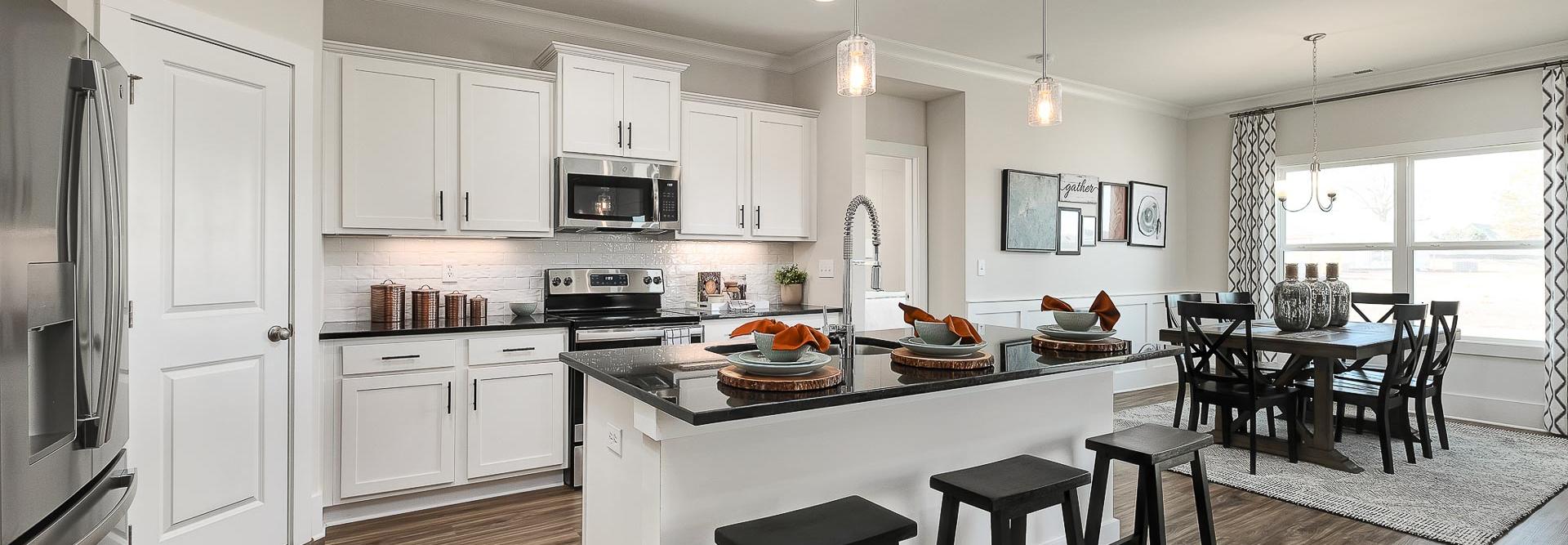 vibrant kitchen with center island and stainless appliances