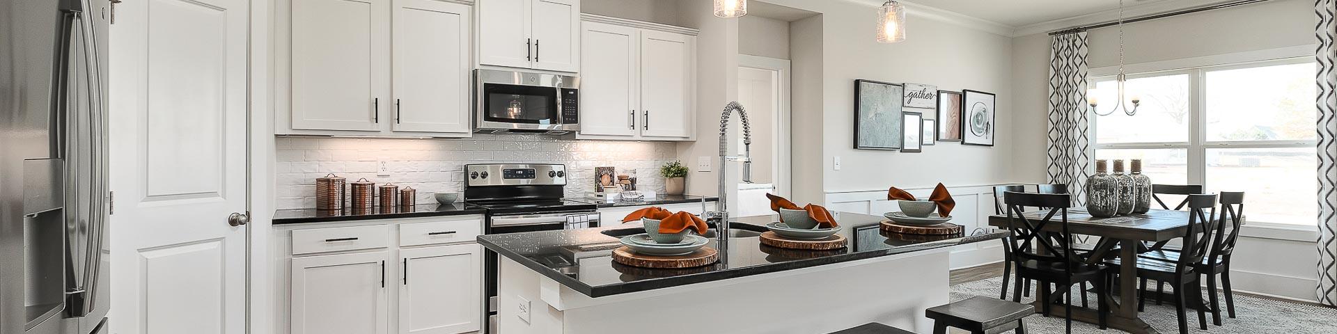 vibrant kitchen with center island and stainless appliances
