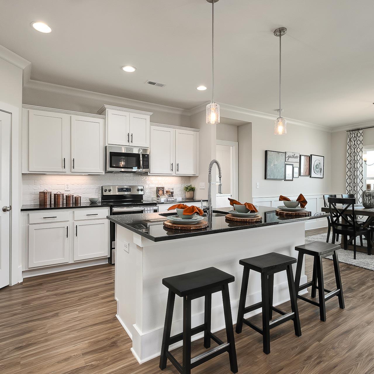 vibrant kitchen with center island and stainless appliances