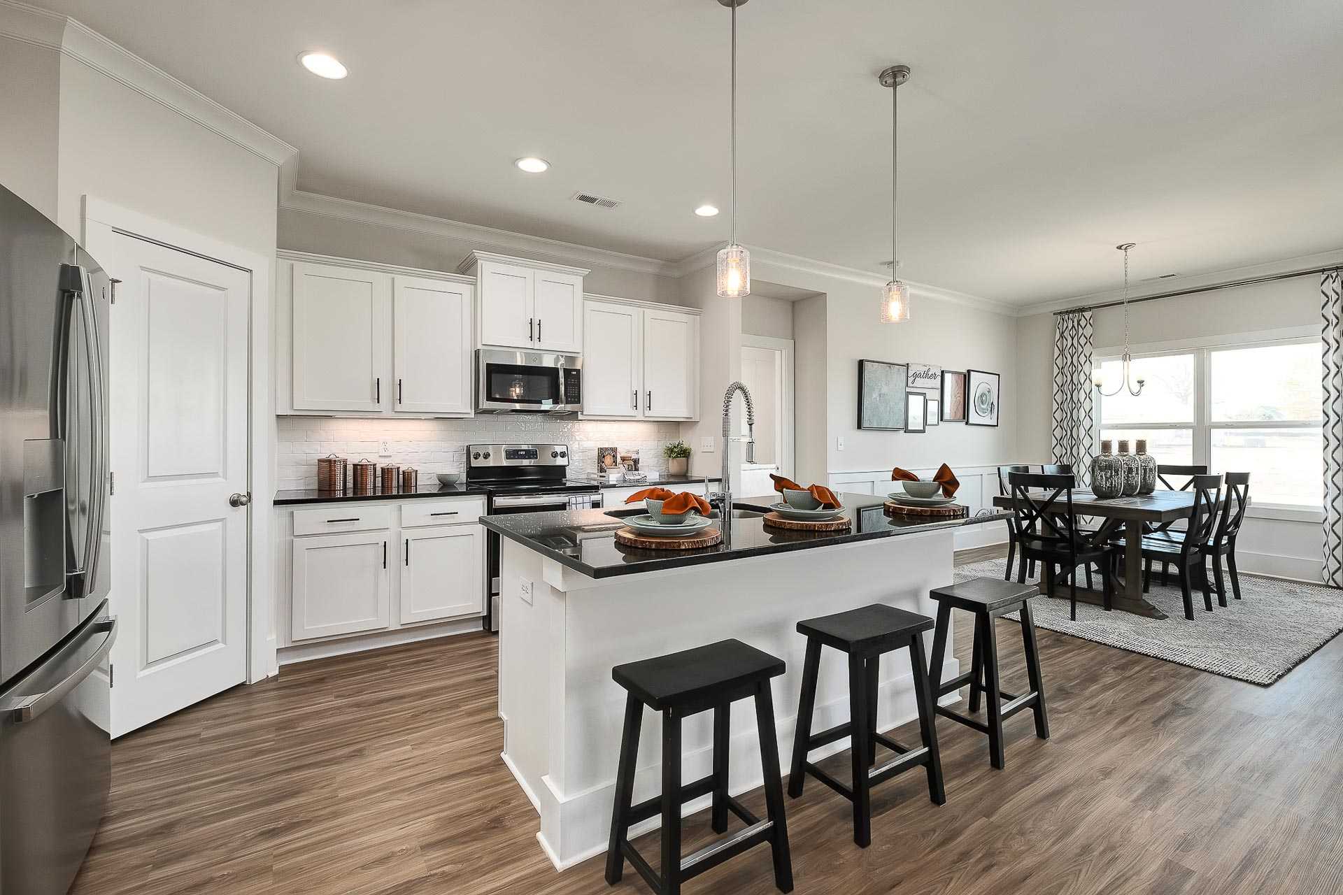 vibrant kitchen with center island and stainless appliances