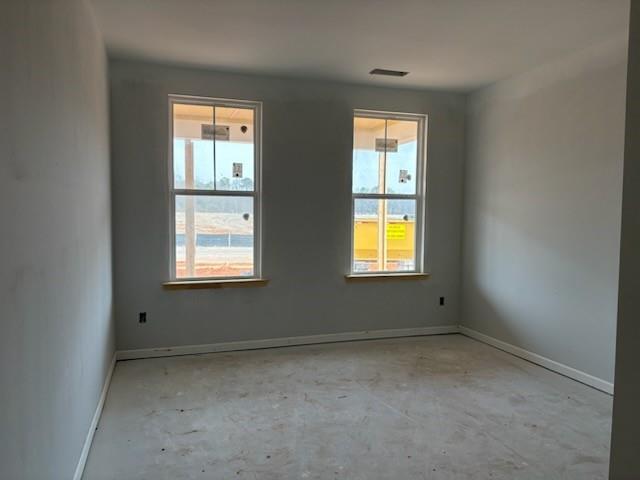 Bright secondary bedroom with dual large windows and natural light in Davidson Homes The Hickory B, Cedar Farms, Winder, Georgia