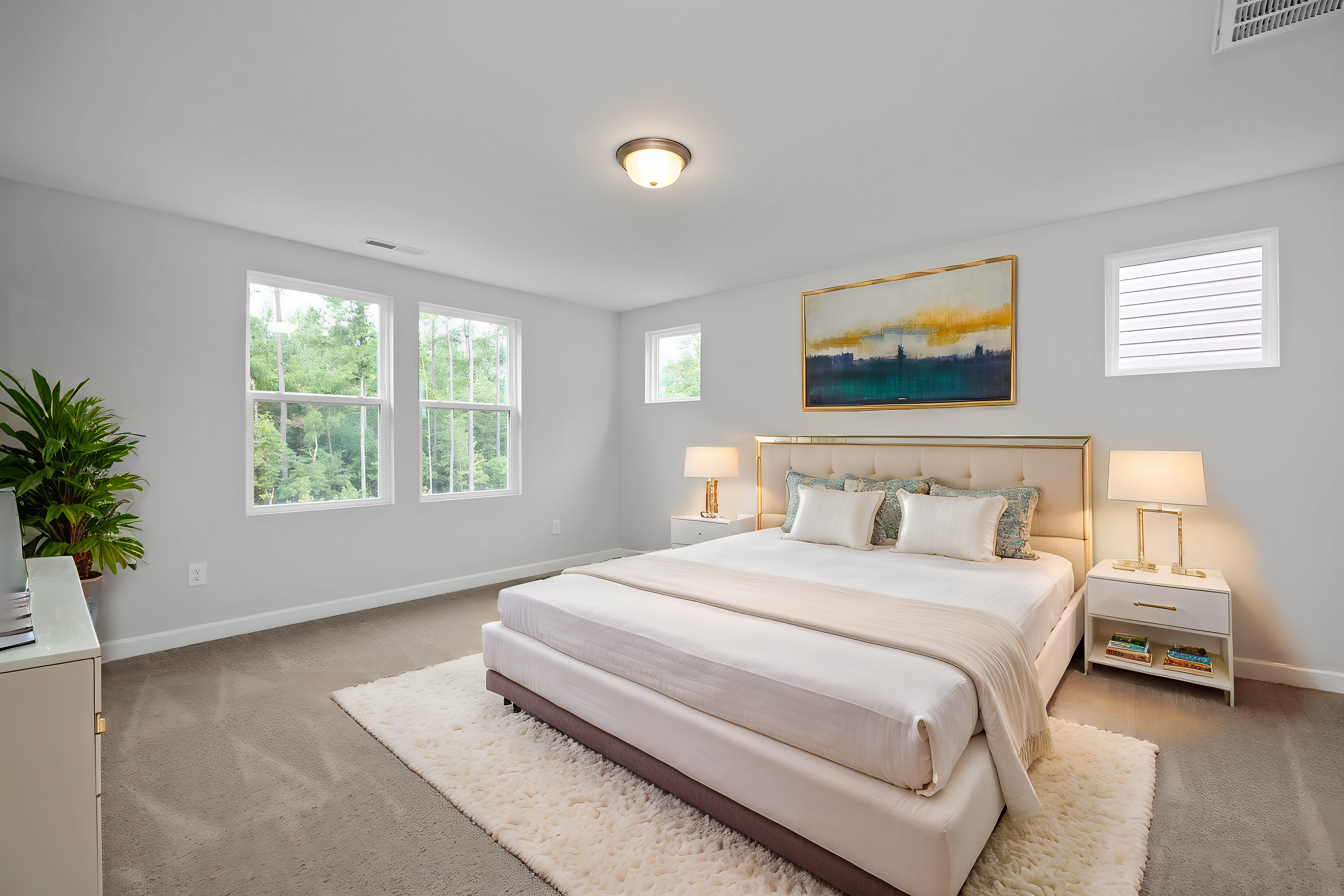 Serene master bedroom with king bed, abstract wall art, bedside lamps, and tree-view windows in Davidson Homes The Durham E, Wylie