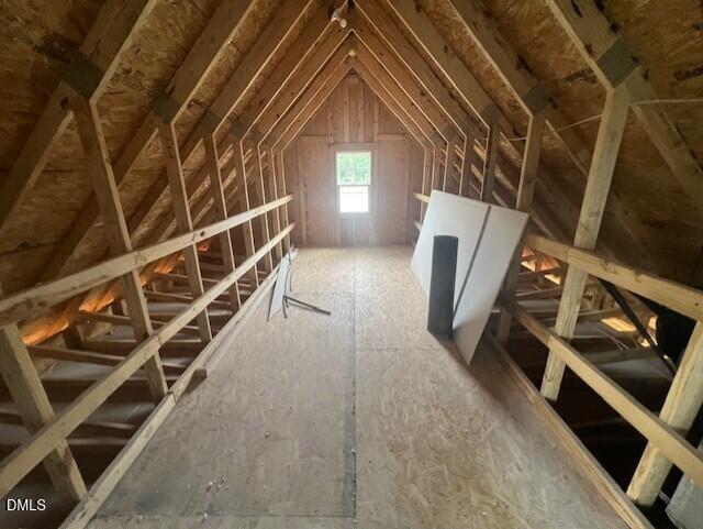 Unfinished attic space with wooden framing in The Ash B floor plan at Retreat at North Main, Lillington, North Carolina.