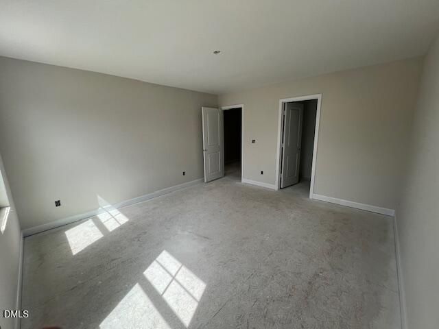 Spacious secondary bedroom with closet and bath access, natural light from windows in Davidson Homes The Preston A, Lillington, NC