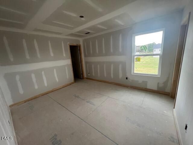 Unfinished bedroom with drywall in The Hickory II C floor plan at Retreat at North Main in Lillington, North Carolina.