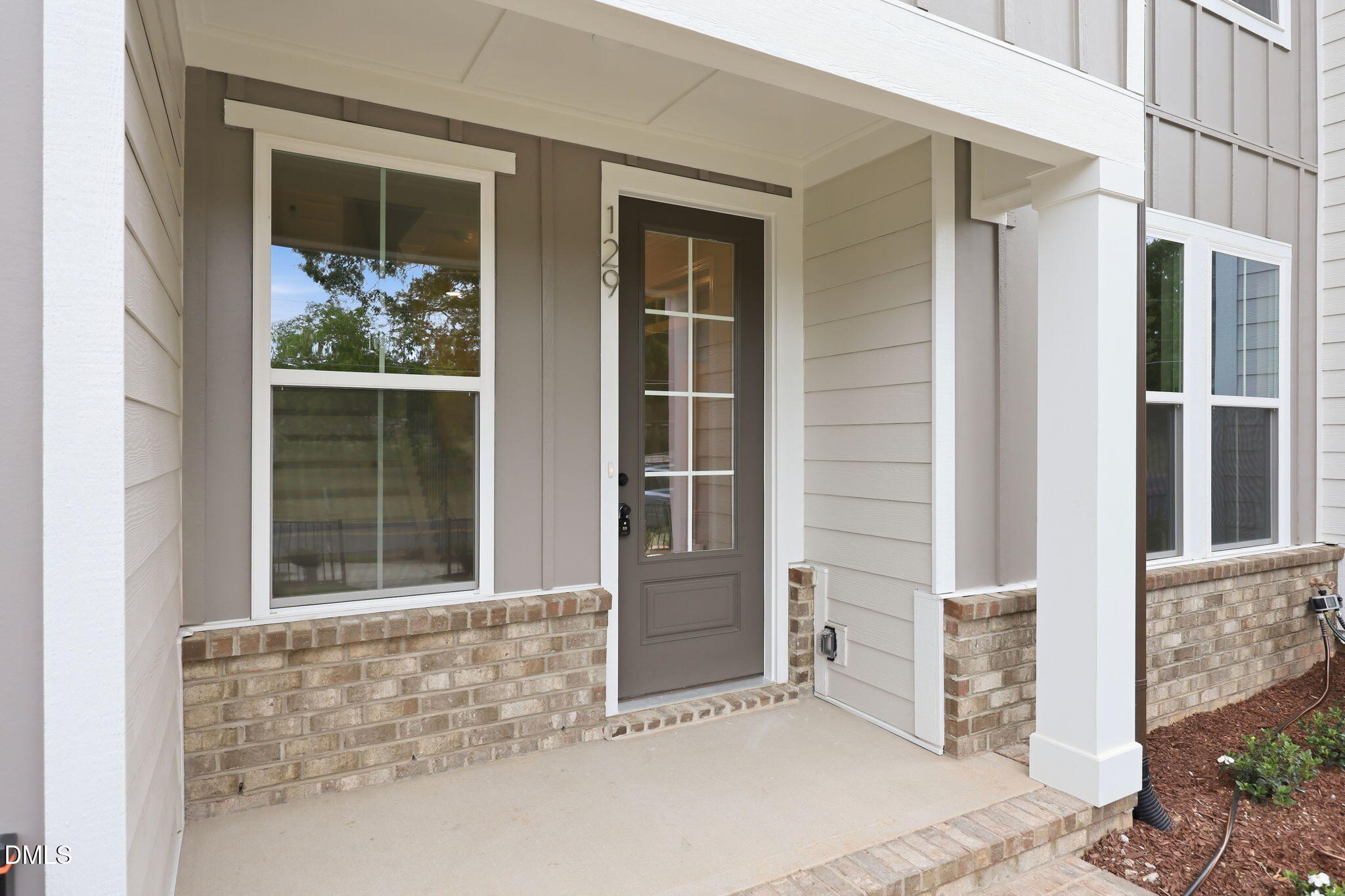 Covered front porch entrance of The Mitchell floor plan by Davidson Homes in Camden Park, Knightdale, North Carolina.