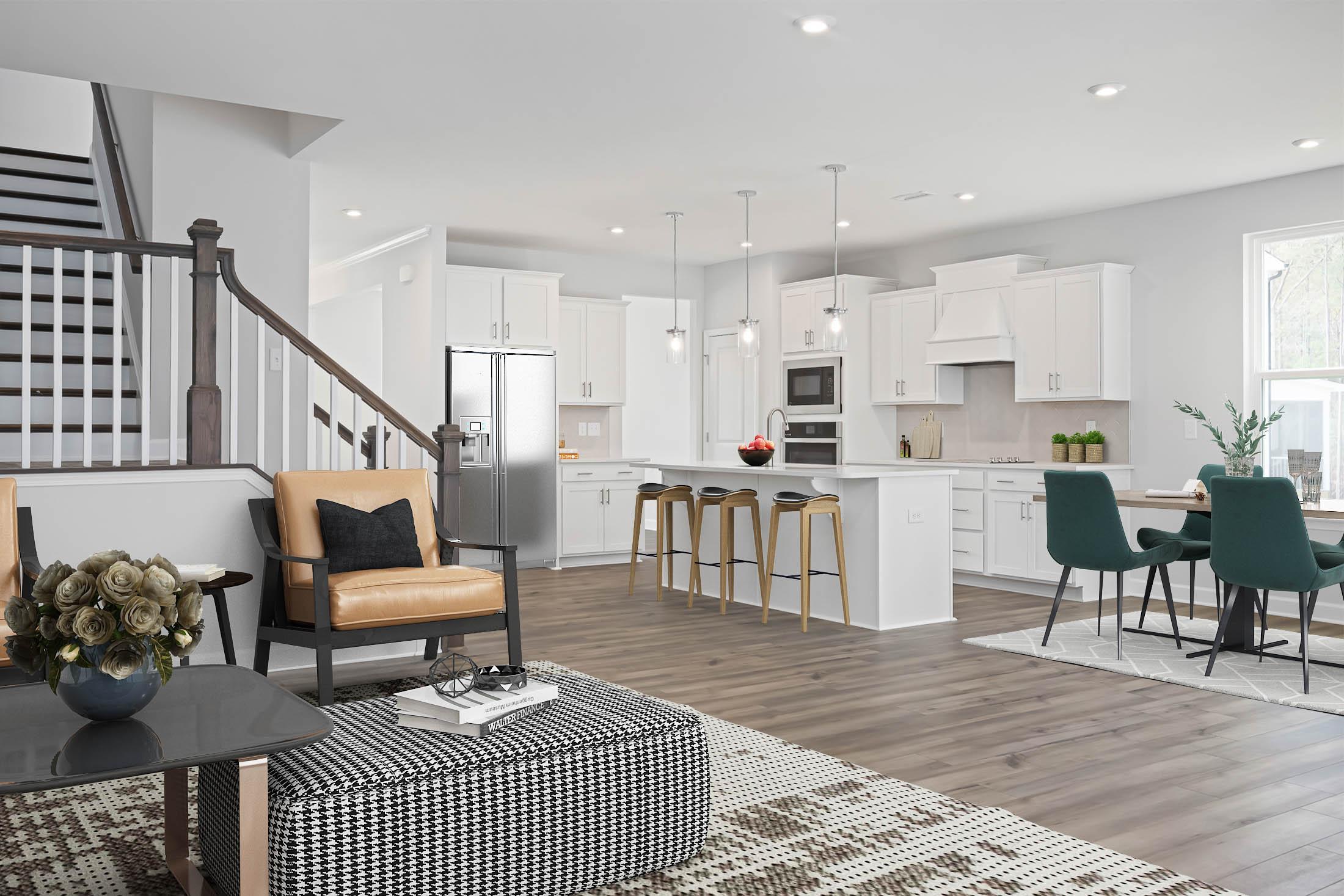 Open-concept kitchen and living area in Stagecoach Corner Mebane NC with white cabinets, hardwood floors, island bar and modern seating