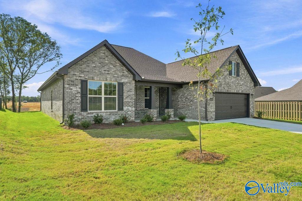 Brick exterior of The Rockford floor plan by Davidson Homes with a 2-car garage in Cain Park, Hartselle, Alabama.