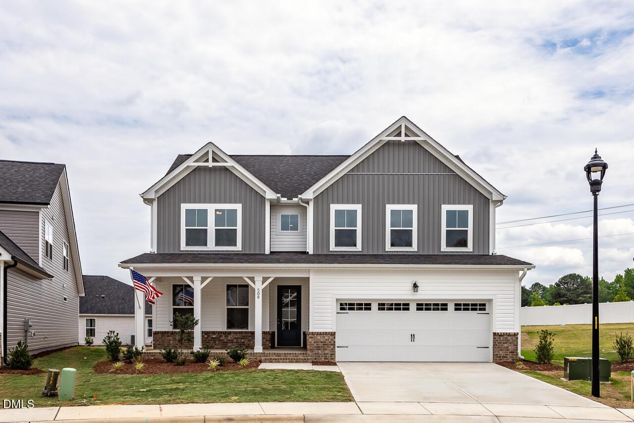 Two-story Willow B floor plan by Davidson Homes with a two-car garage in Woodland Crossing, Zebulon, North Carolina.
