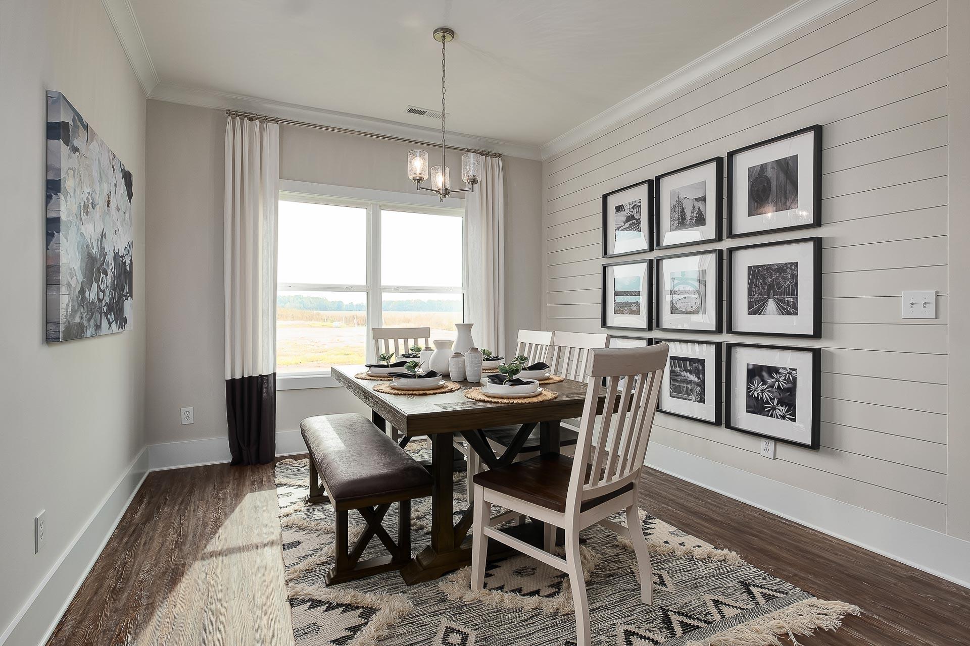 dining room situated right off kitchen with picture wall in Cullman, AL