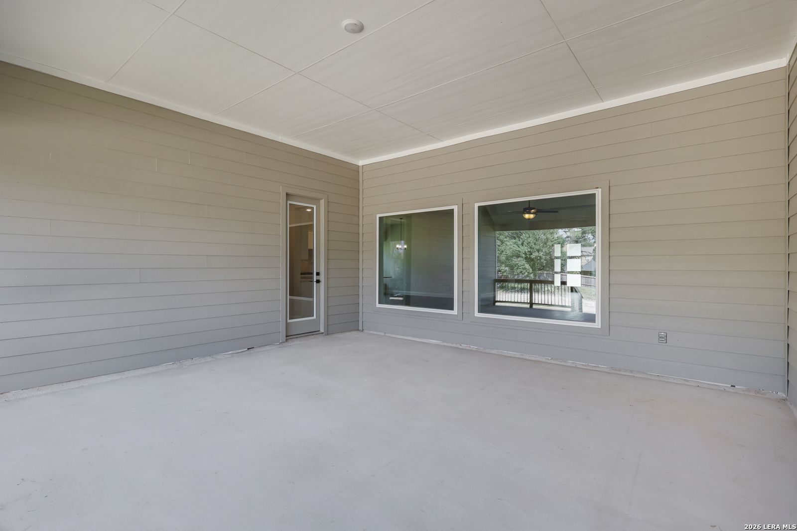 Spacious covered patio at The Summerlin B floor plan by Davidson Homes in Potranco Oaks, Castroville, Texas.