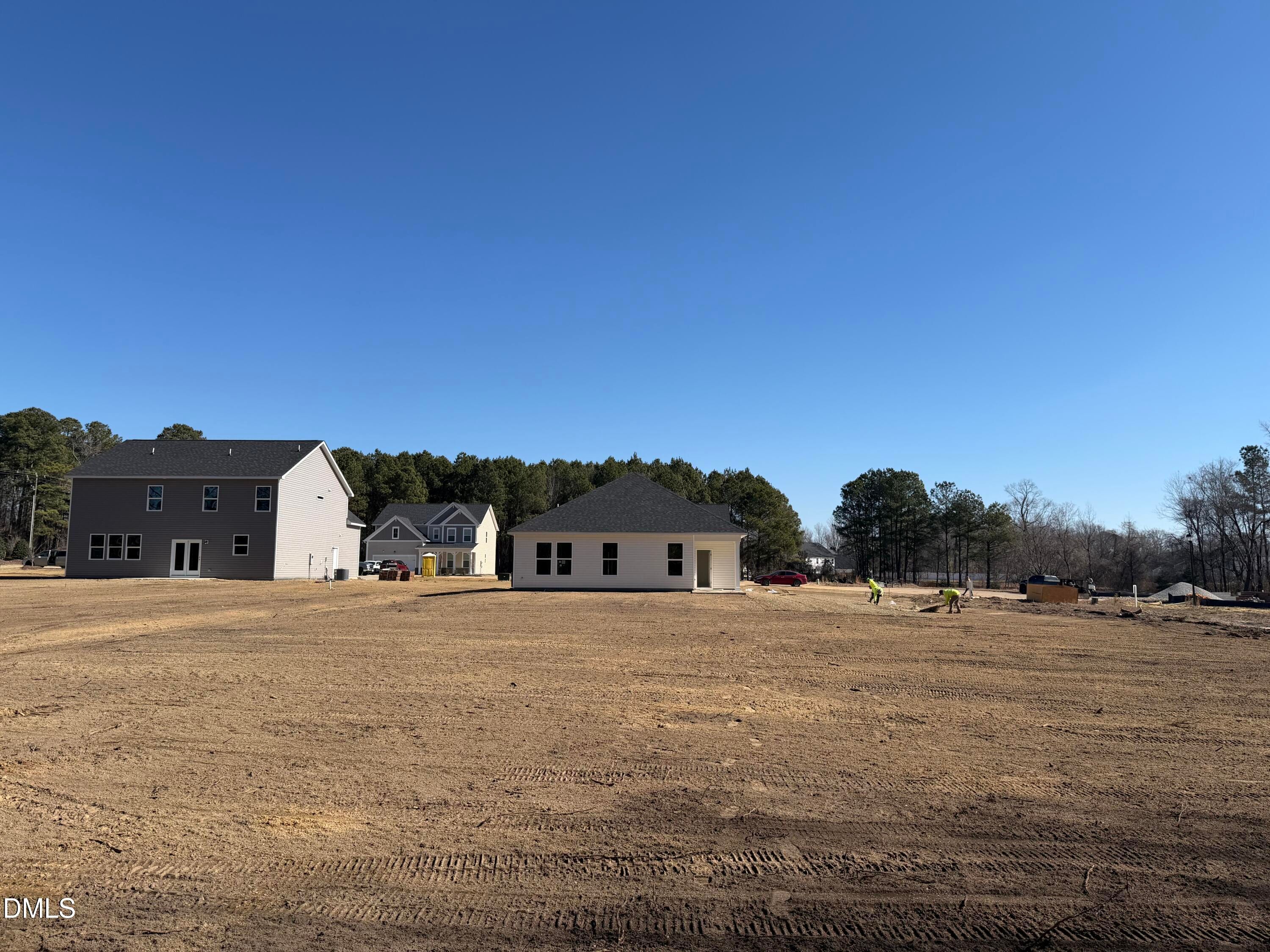 New construction single-story homes with garages on cleared lot in Wellers Knoll, Lillington, North Carolina by Davidson Homes