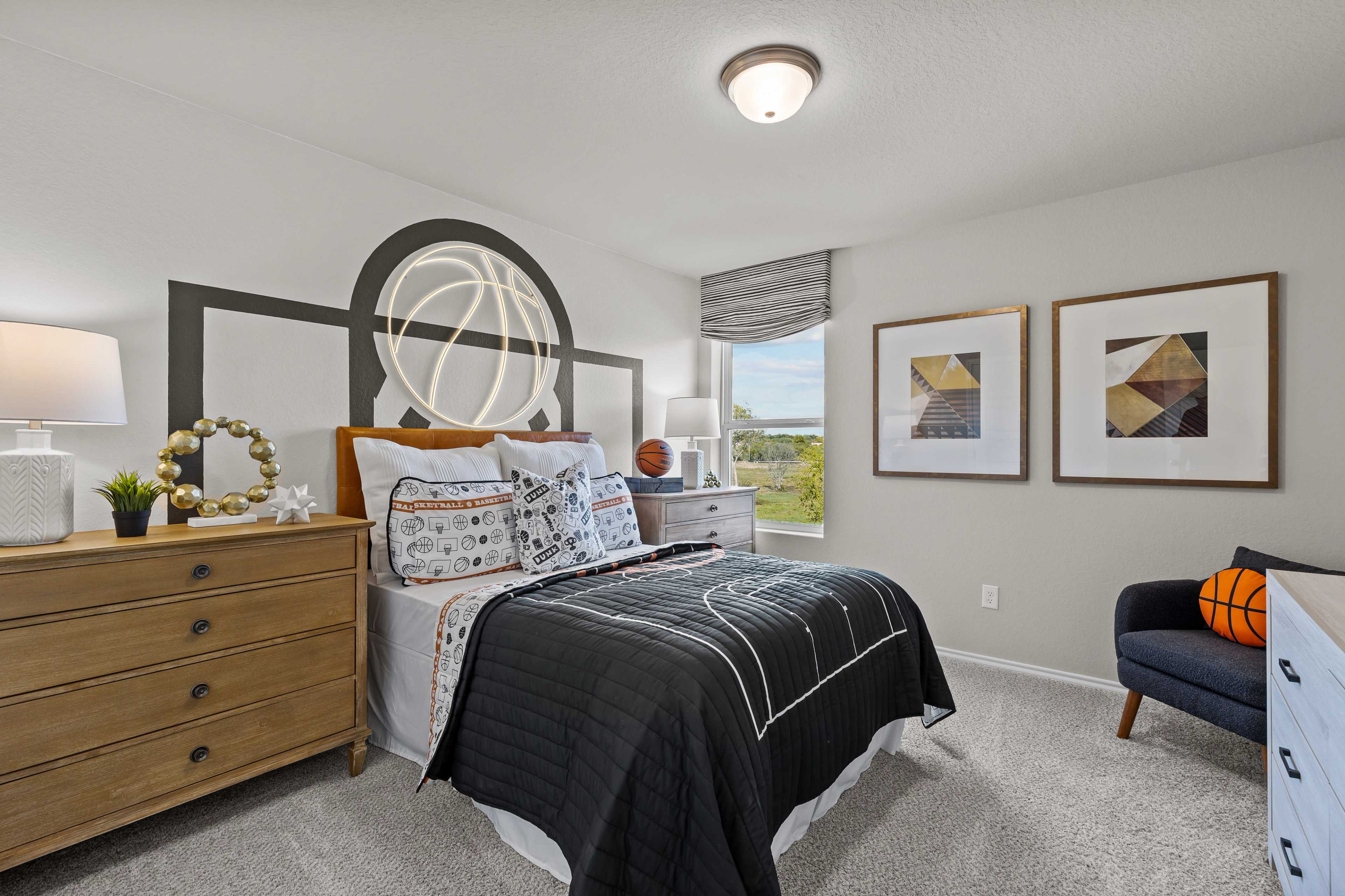 Basketball-themed youth bedroom at Applewhite Meadows in San Antonio TX by Davidson Homes with hoop headboard and sports bedding
