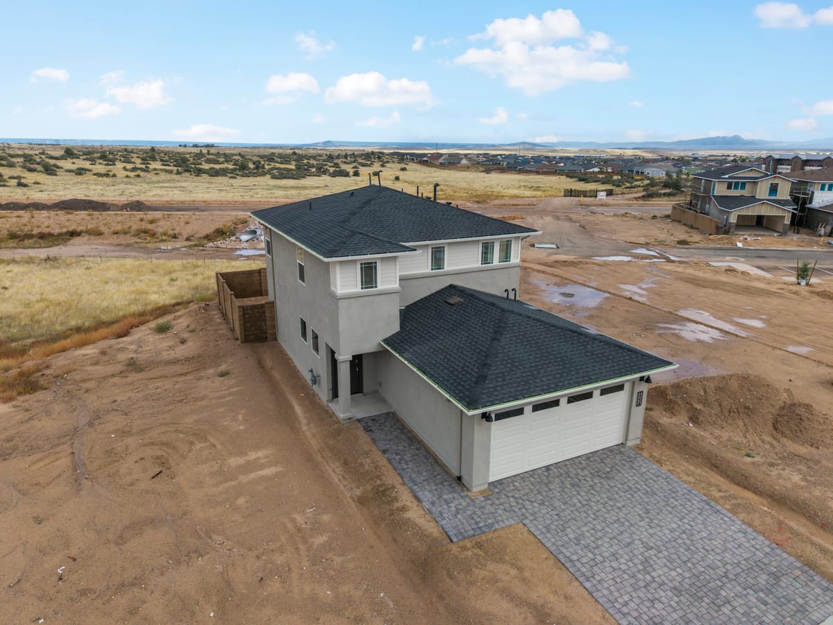 Aerial view of The Raleigh, a 2-story Davidson Homes new construction home in Prescott, AZ with 3-car garage.