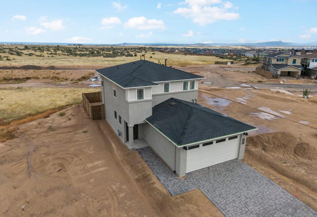 Aerial view of The Raleigh, a 2-story Davidson Homes new construction home in Prescott, AZ with 3-car garage.