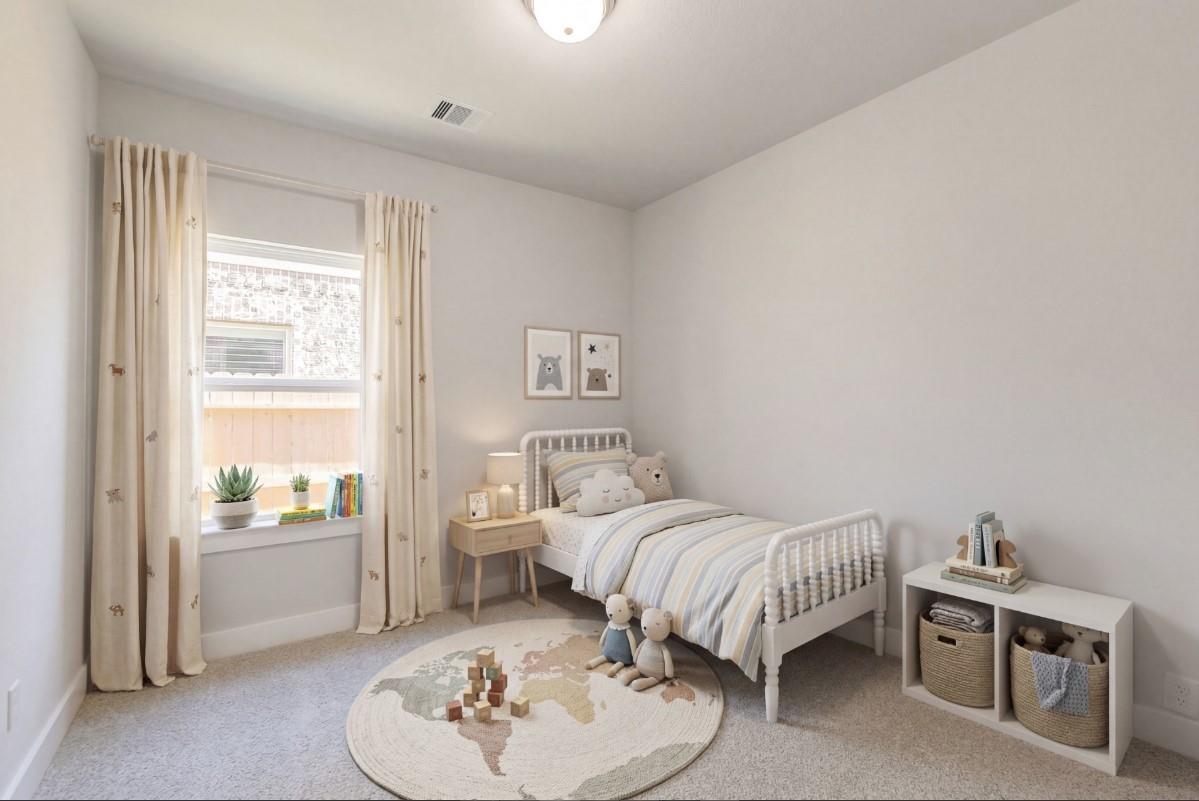Cozy children's bedroom with twin bed, world map rug and sheer curtains in Davidson Homes The Luna J, Sunterra, Katy, Texas
