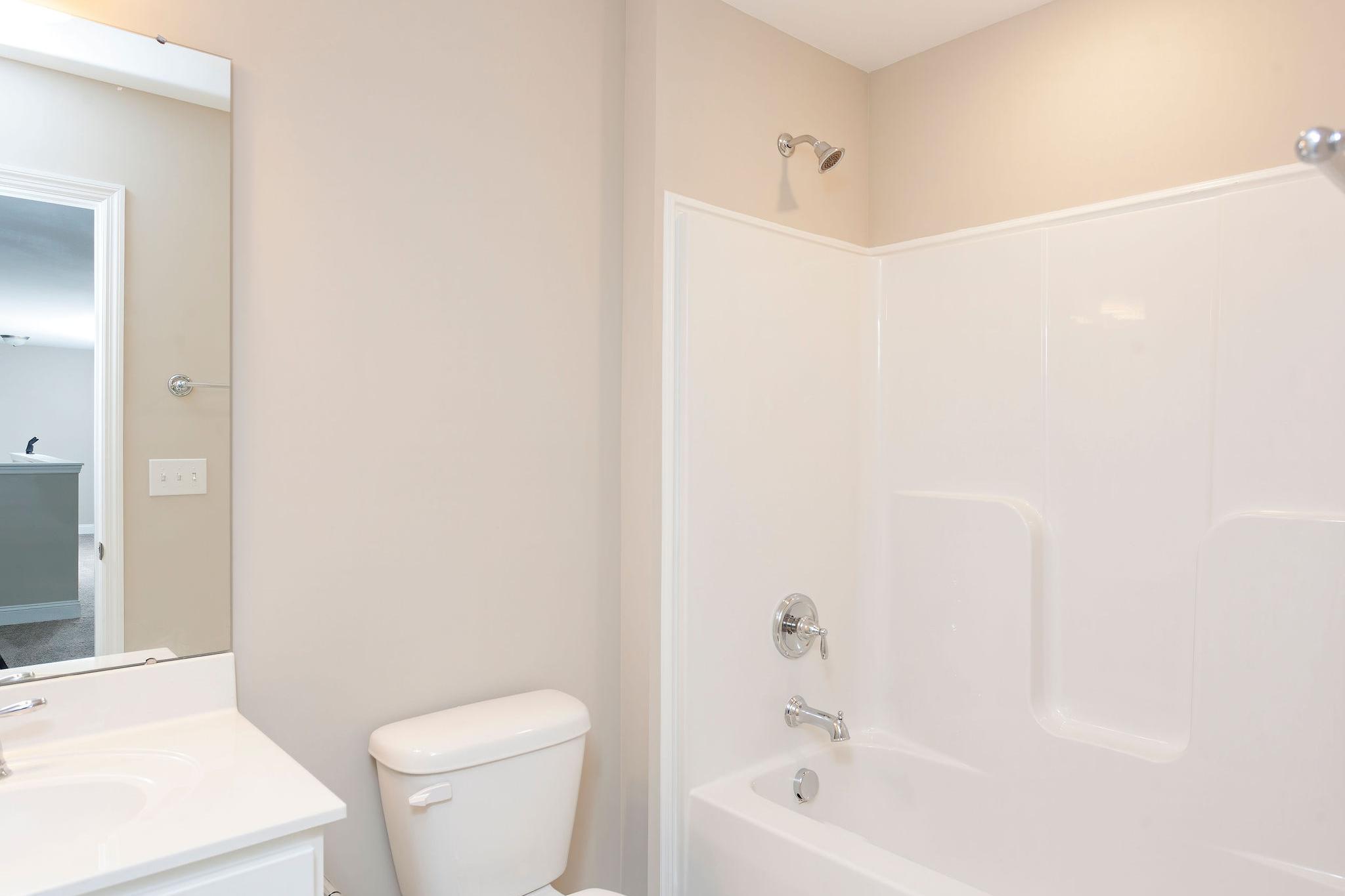 Davidson Homes The Emory Floor Plan Bathroom with single vanity, toilet, and shower