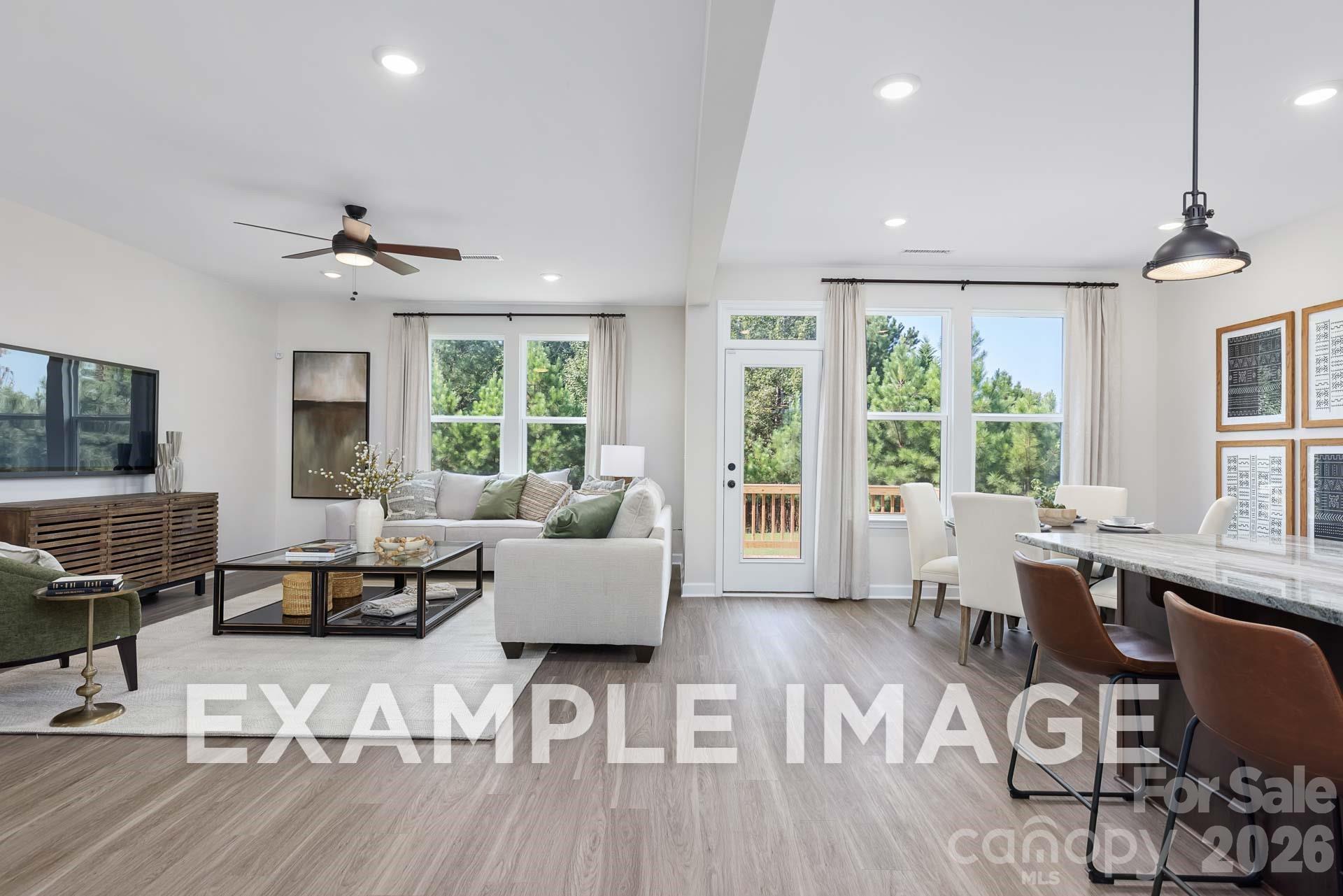 Open-concept living room and dining area in The Willow B floor plan by Davidson Homes in Windgate, Mooresville, NC.