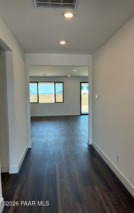 Bright open-concept hallway with wood-style flooring in The Durango II G at South Ranch Western Collection, Prescott, Arizona.