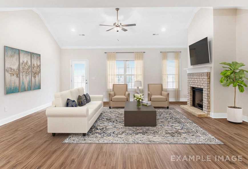 spacious living room with fireplace and natural light