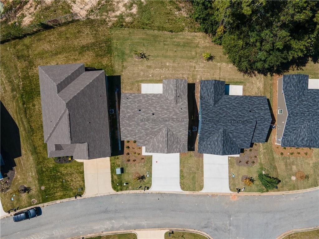 Aerial view of three The Washington 3-bedroom single-story homes by Davidson Homes in Summer Vineyard, Phenix City, Alabama