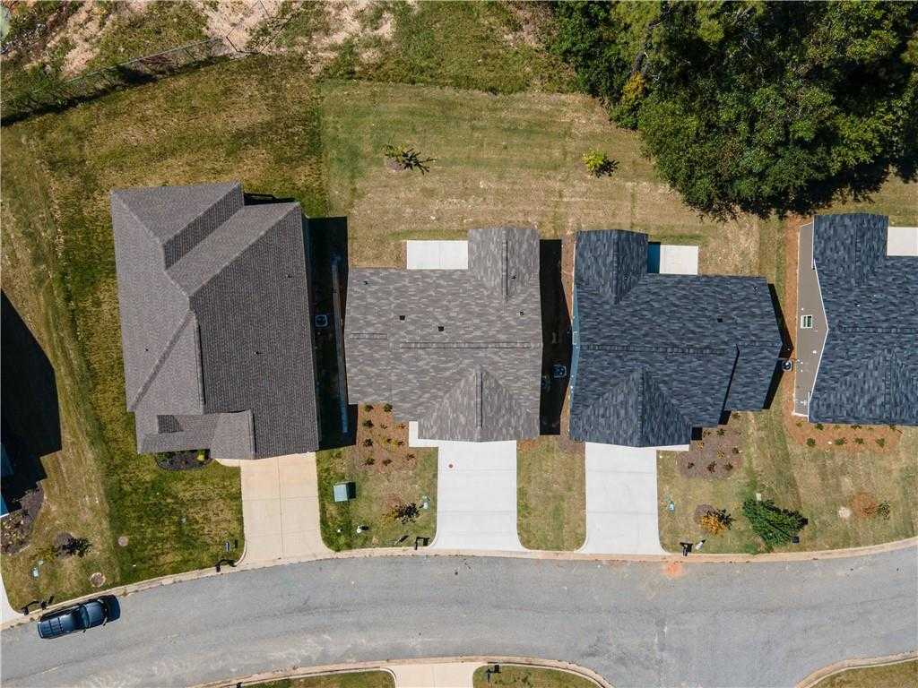 Aerial view of three The Washington 3-bedroom single-story homes by Davidson Homes in Summer Vineyard, Phenix City, Alabama