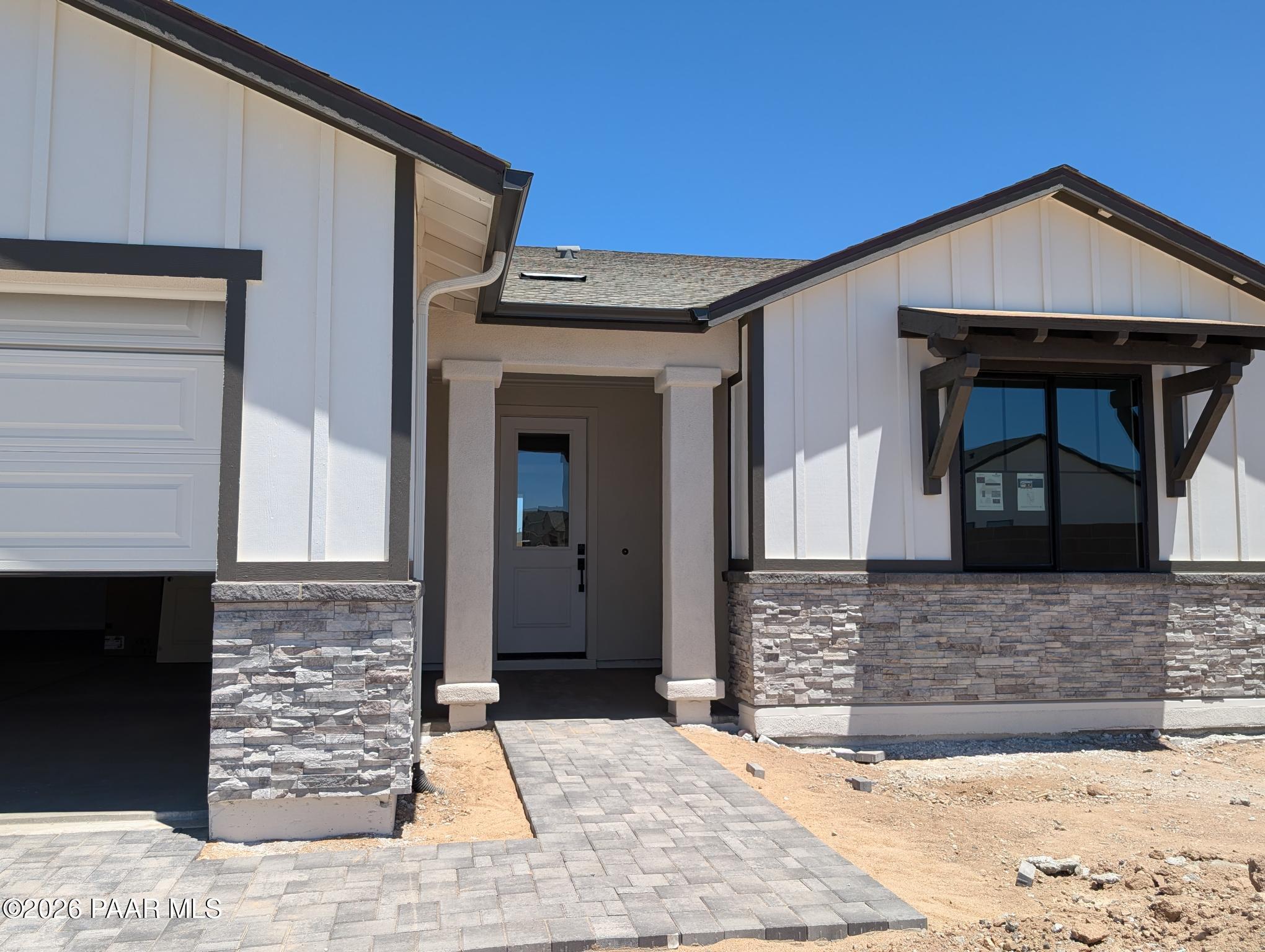 Modern farmhouse exterior of The Durango II G floor plan by Davidson Homes in South Ranch, Prescott, Arizona.
