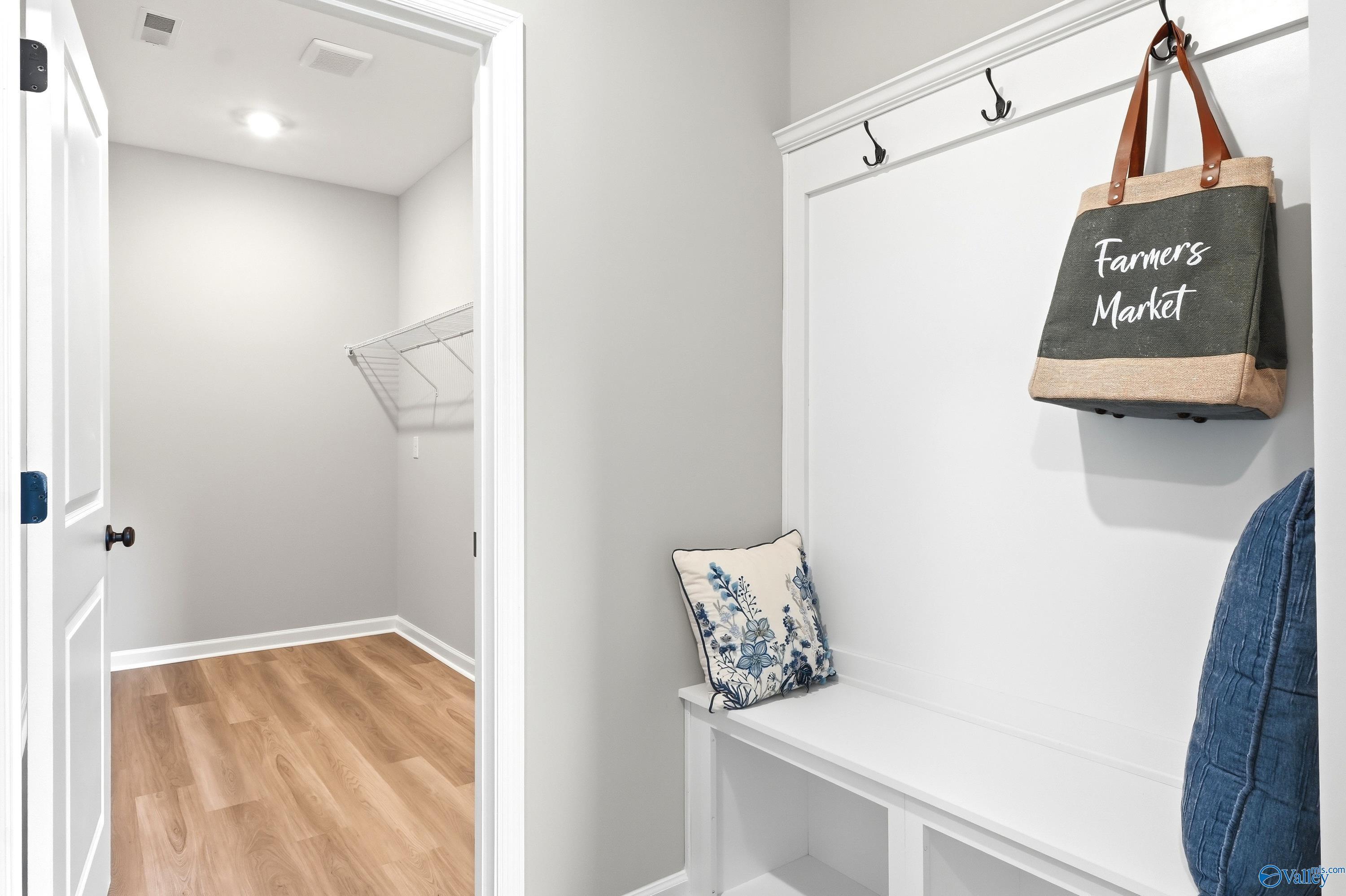 Built-in mudroom bench with coat hooks and storage in The Dorado floor plan at Riverton Preserve, Huntsville, Alabama.