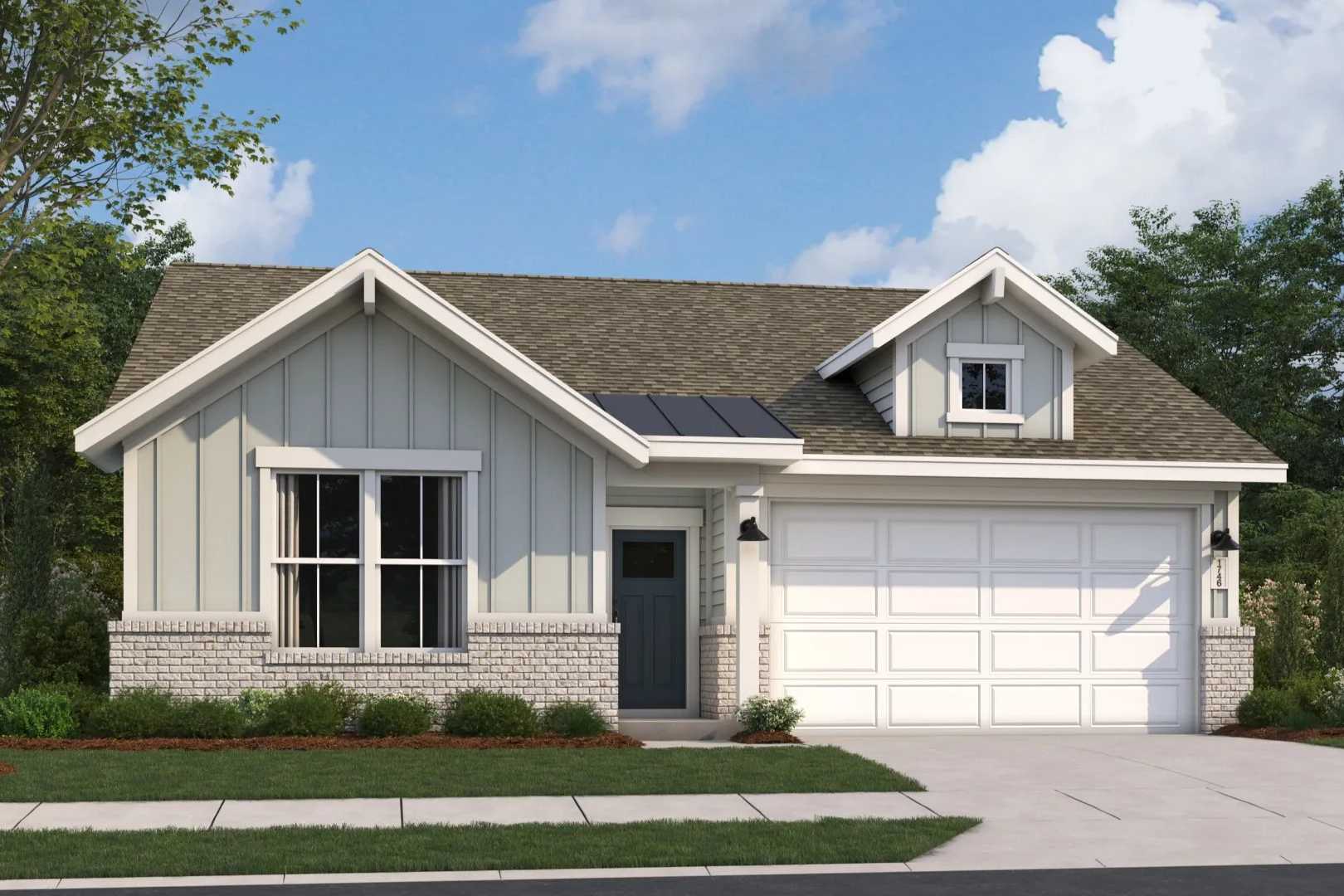 Craftsman-style single-story home exterior in Anderson Lakes Opelika AL with gray siding, white garage, and mature trees