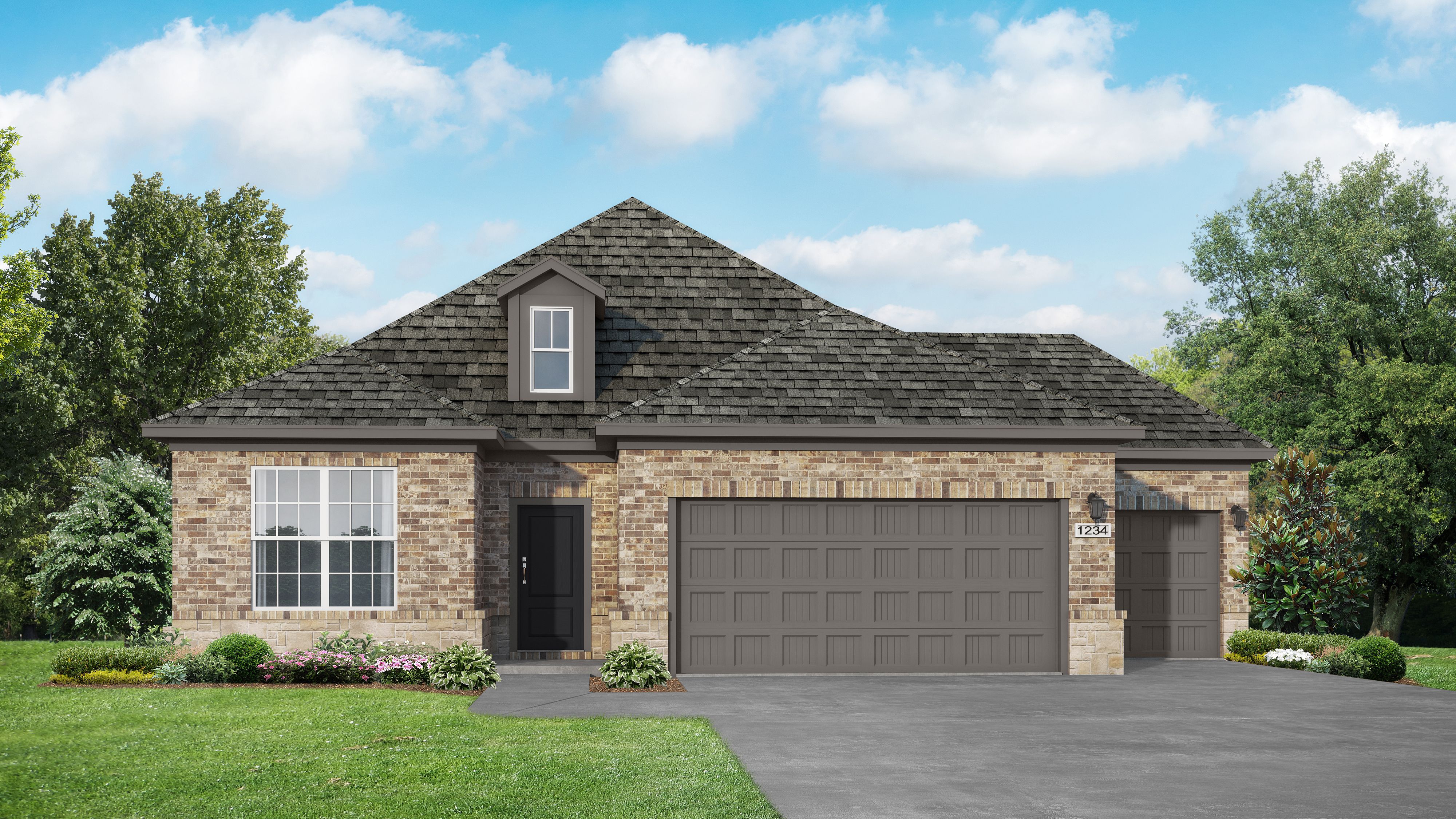 Brick exterior of The Everett E single-story home with 3-car garage, gabled roof, and landscaped yard by Davidson Homes