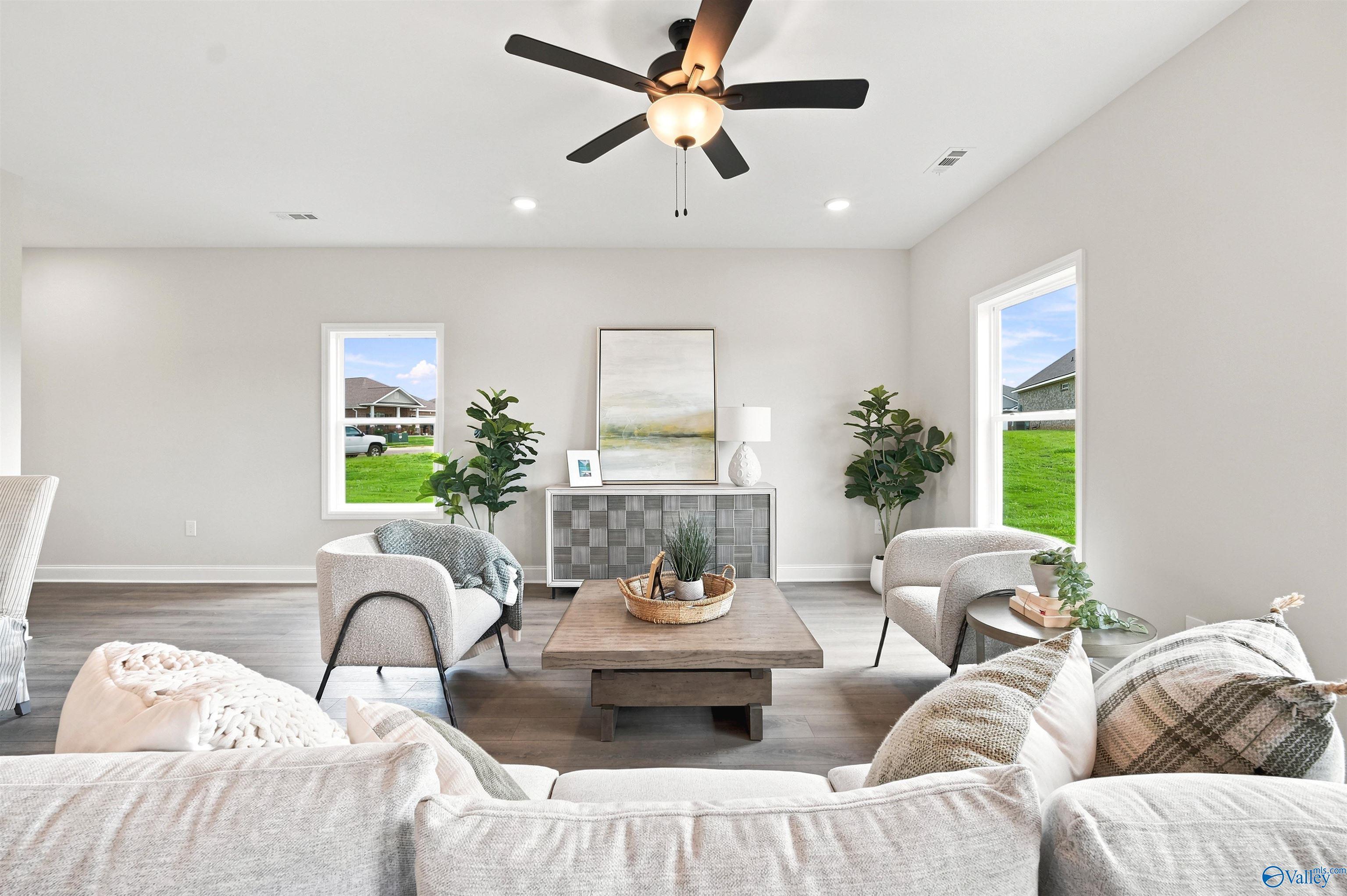Bright, open-concept living room in The Burton B floor plan at Heritage Lakes, New Market, Alabama.