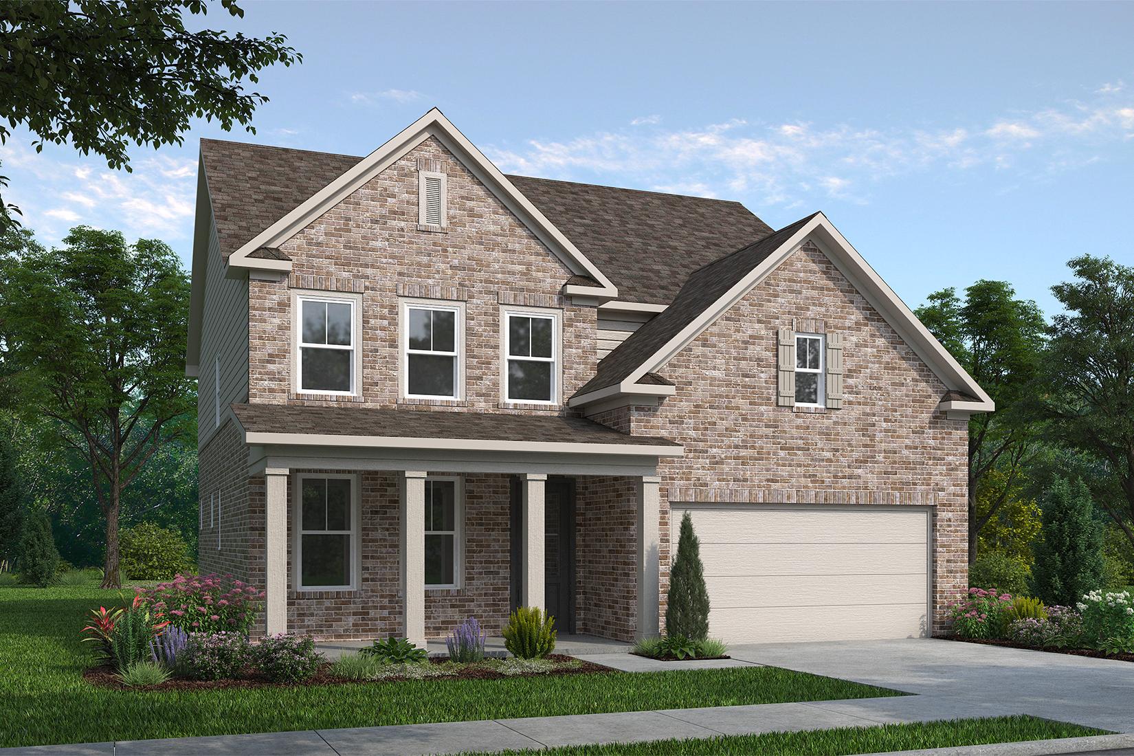 Two-story The Hickory G home elevation with brick and siding facade, covered front porch, two-car garage, and landscaped yard in Buford GA