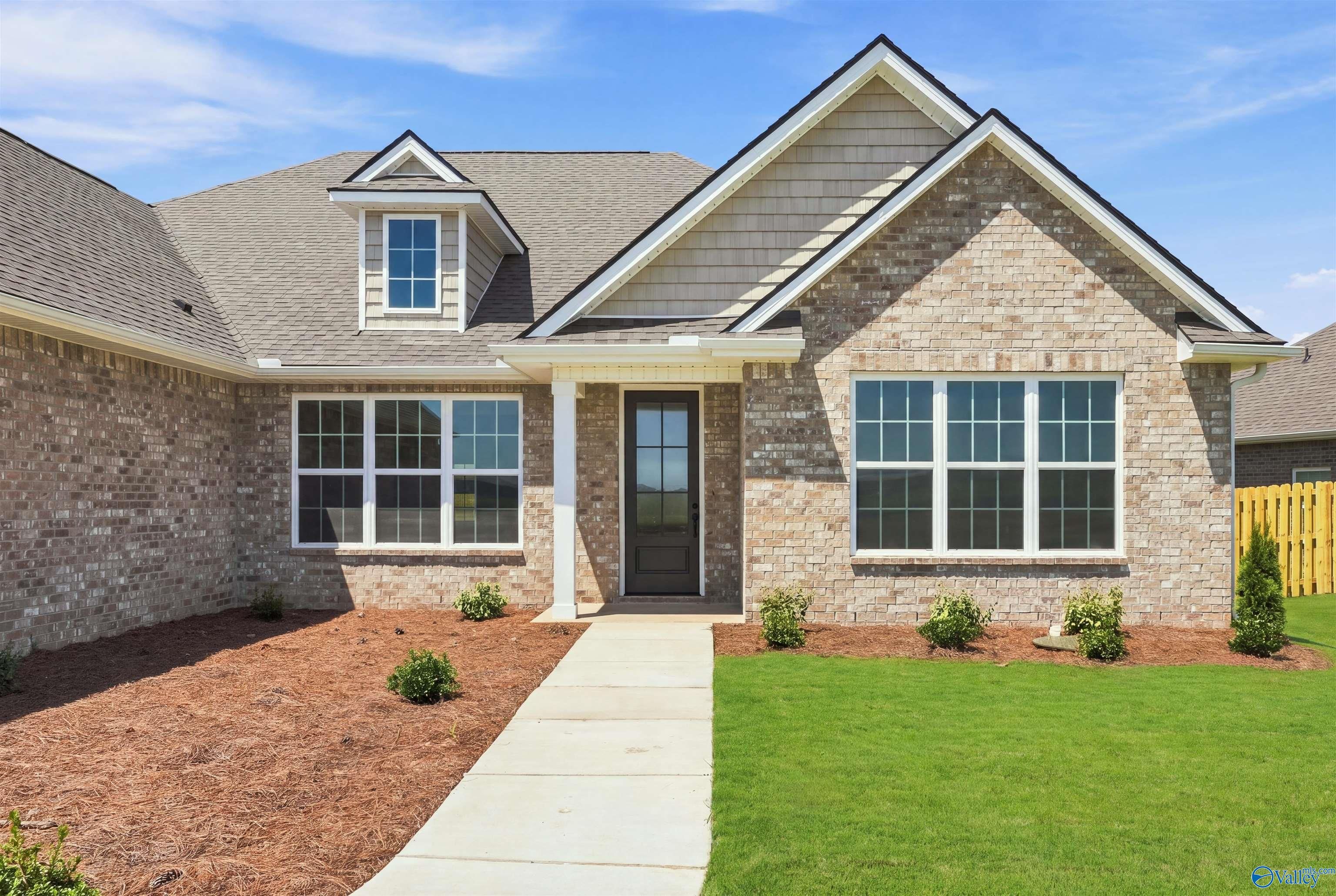 Brick exterior of The Oxford floor plan by Davidson Homes in Kendall Farms, Toney, Alabama.